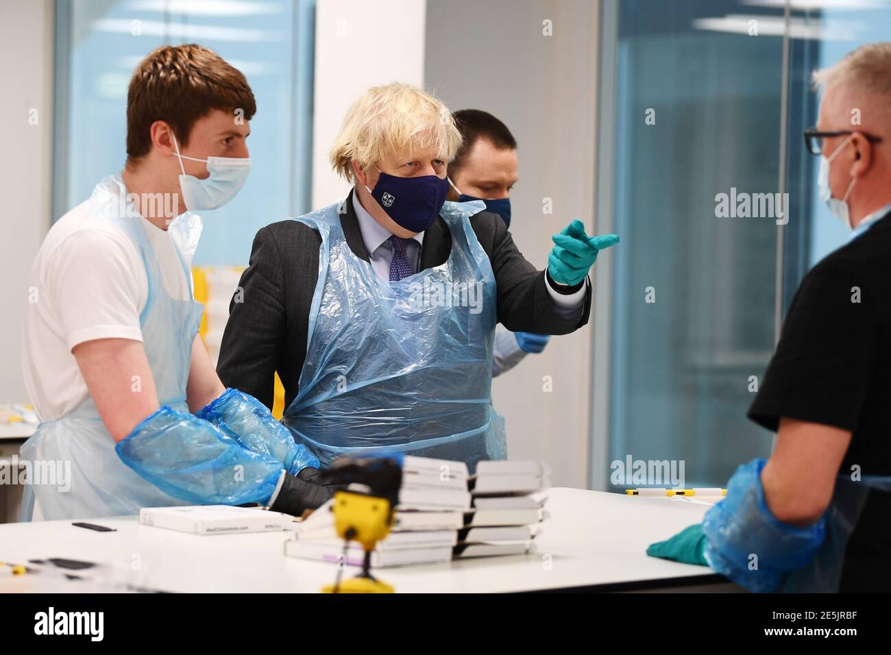 Prime Minister Boris Johnson (centre) is shown the Lighthouse ...