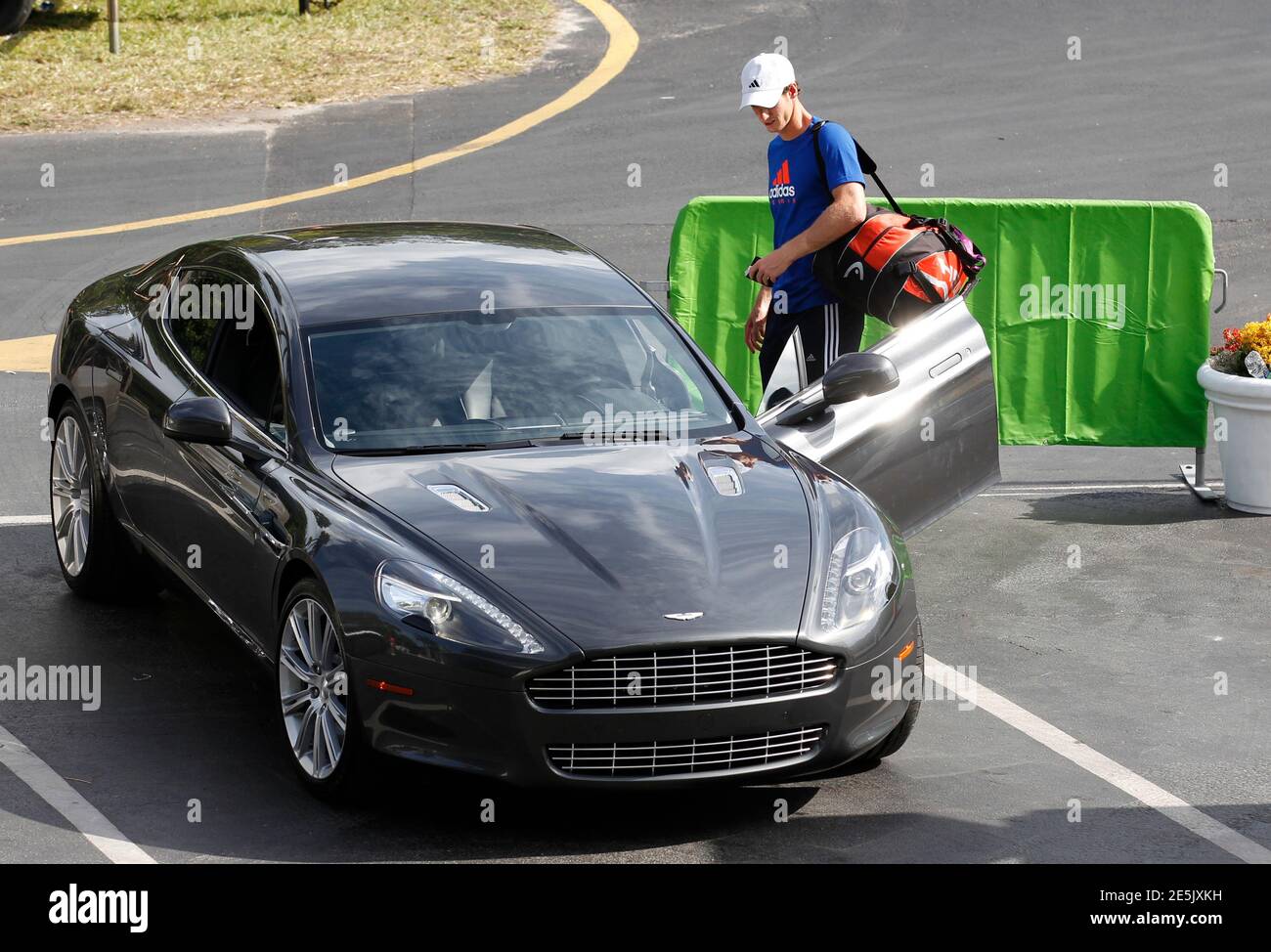 British tennis player Andy Murray gets into an Aston Martin at the Sony Ericsson Open tennis tournament in Key Biscayne, Florida March 20, 2012.  REUTERS/Kevin Lamarque  (UNITED STATES - Tags: SPORT TENNIS TRANSPORT) Stock Photo