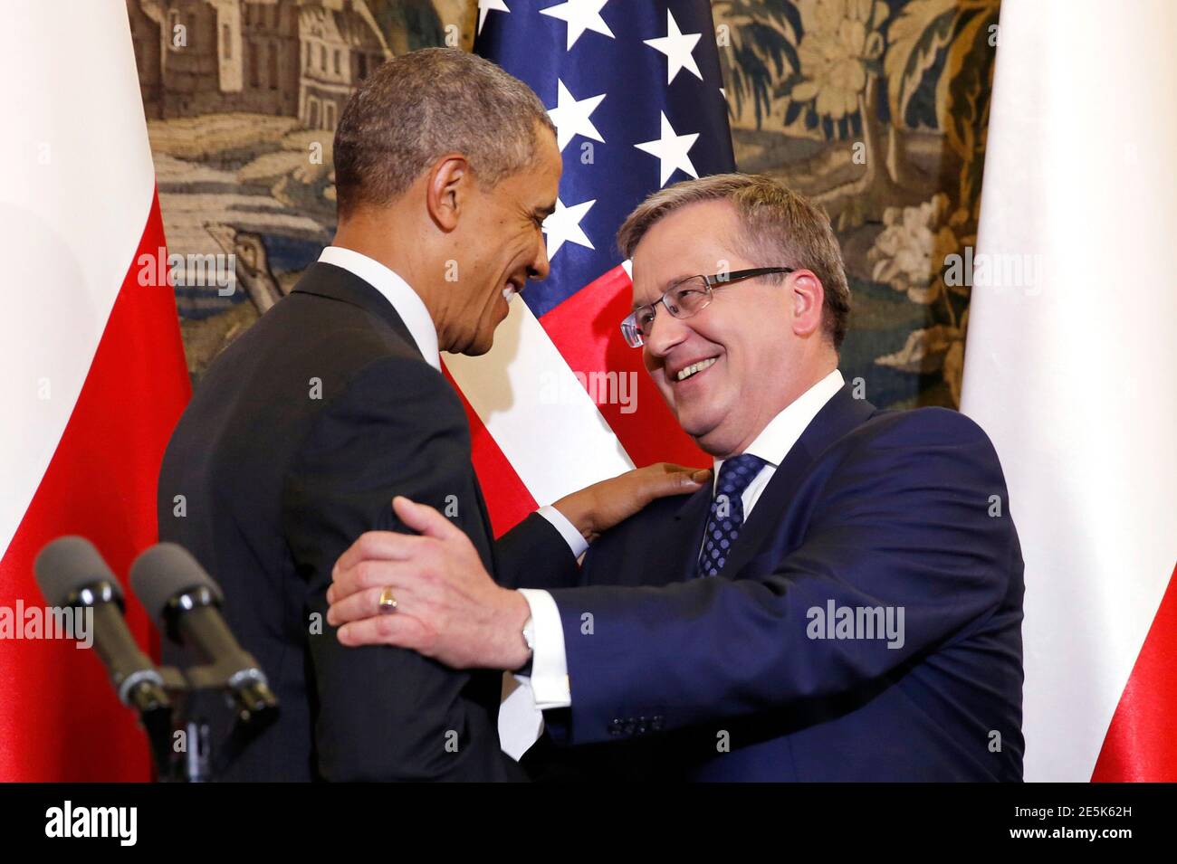 U.S. President Barack Obama hugs Poland's President Bronislaw Komorowski at the conclusion of a news conference at Belweder Palace in Warsaw June 3, 2014.  Obama is visiting Warsaw, Brussels, Paris and Normandy this week where he is expected to elaborate on the U.S. commitment to counter Russian moves against Ukraine and reassure nervous allies the United States has their backs. REUTERS/Kevin Lamarque  (POLAND - Tags: POLITICS) Stock Photo