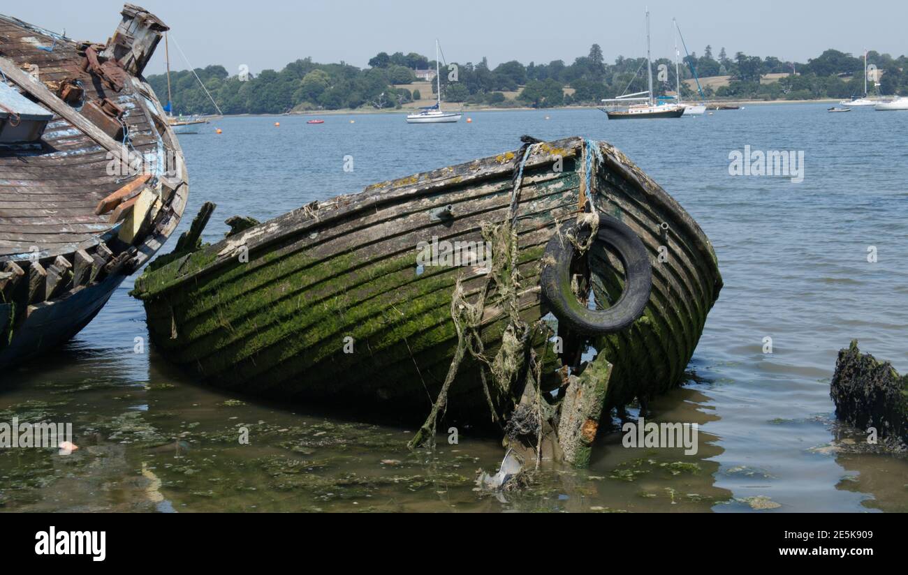 Two disintegrating old wooden boats. Stock Photo