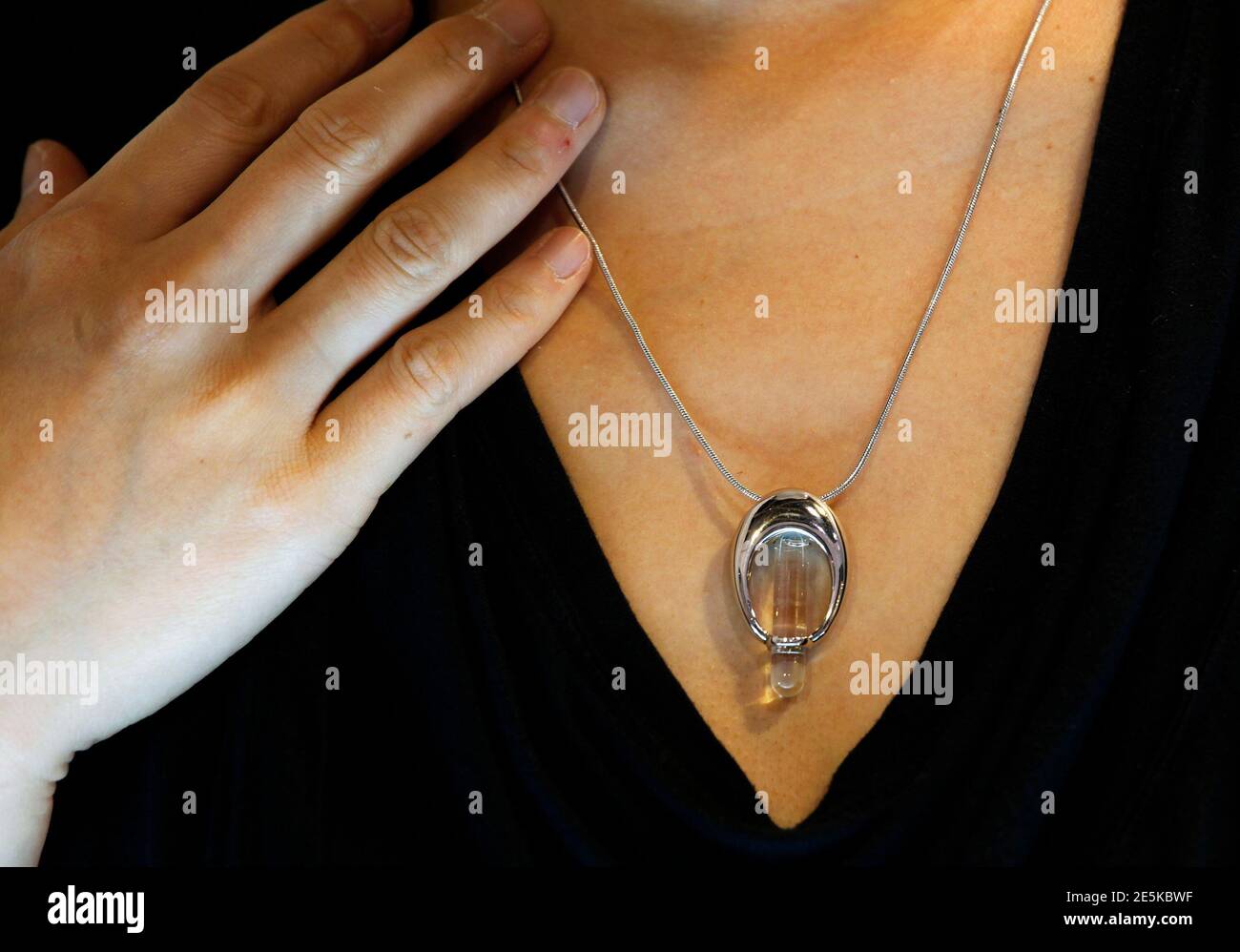 https www alamy com an exhibitor poses with a dna necklace a locket made by a hong kong company containing dna of a person during asia funeral expo afe in hong kong may 19 2011 afe the key annual event for international funeral professionals for trade education and information exchange is joined by 130 exhibiting companies from around the world organisers said reutersbobby yip china tags society obituary animals image399338171 html