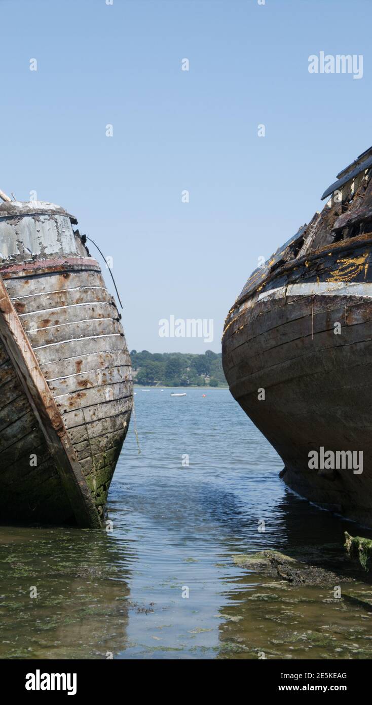Two disintegrating old wooden boats. Stock Photo
