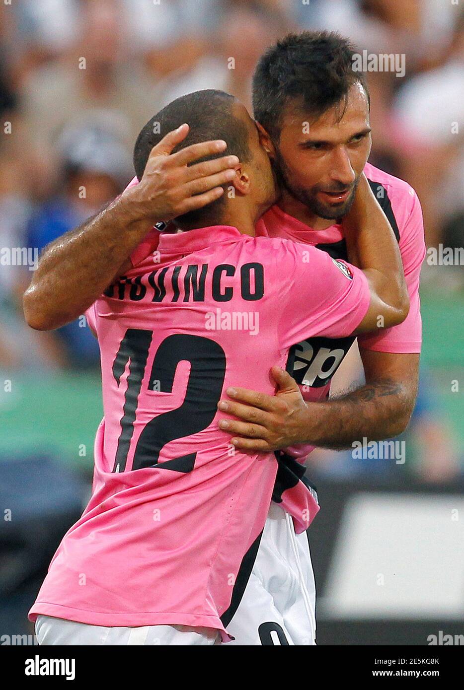 Juventus' Sebastian Giovinco (L) celebrates with his team mate Mirko  Vucinic after scoring a third goal against Udinese during their Italian  Serie A soccer match at the Friuli stadium in Udine September
