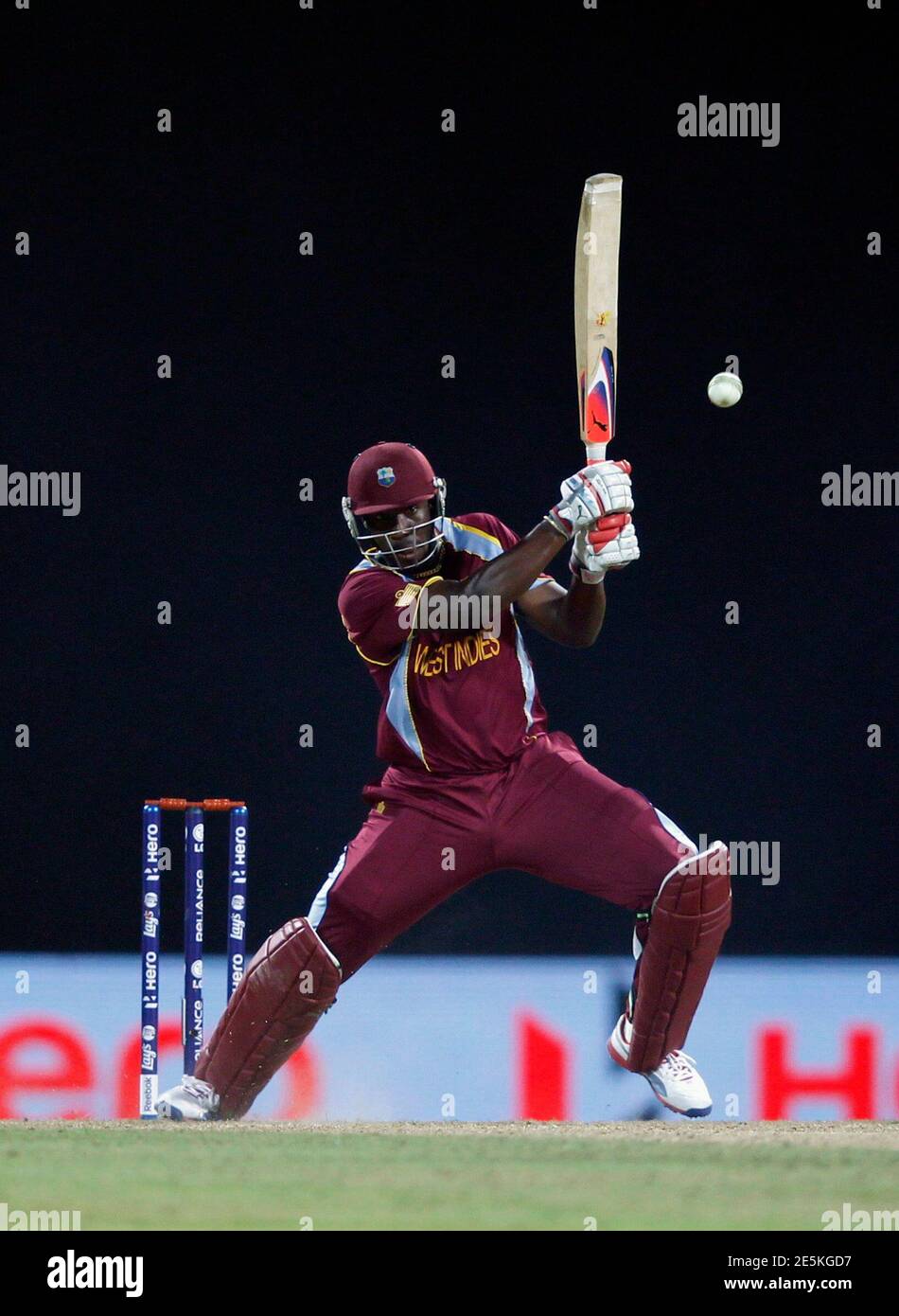 West Indies' Andre Russell plays a shot during their Twenty20 World Cup  Super 8 cricket match against Sri Lanka in Pallekele September 29, 2012.  REUTERS/Dinuka Liyanawatte (SRI LANKA - Tags: SPORT CRICKET