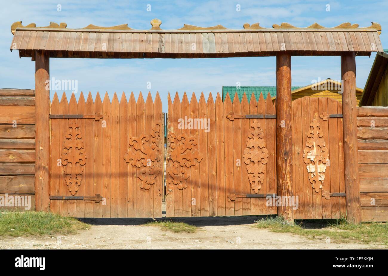 massive wooden gates, wooden fence. village, summer day Stock Photo Alamy