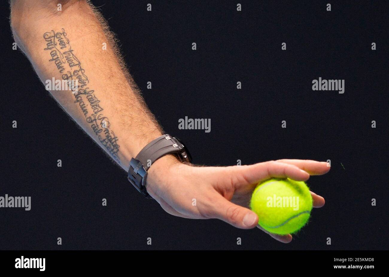 A tattoo reading 'Ever tried. Ever failed. No matter. Try again. Fail  again. Fail better.' is seen on the arm of Stanislas Wawrinka of Switzerland  as he serves during his ATP World