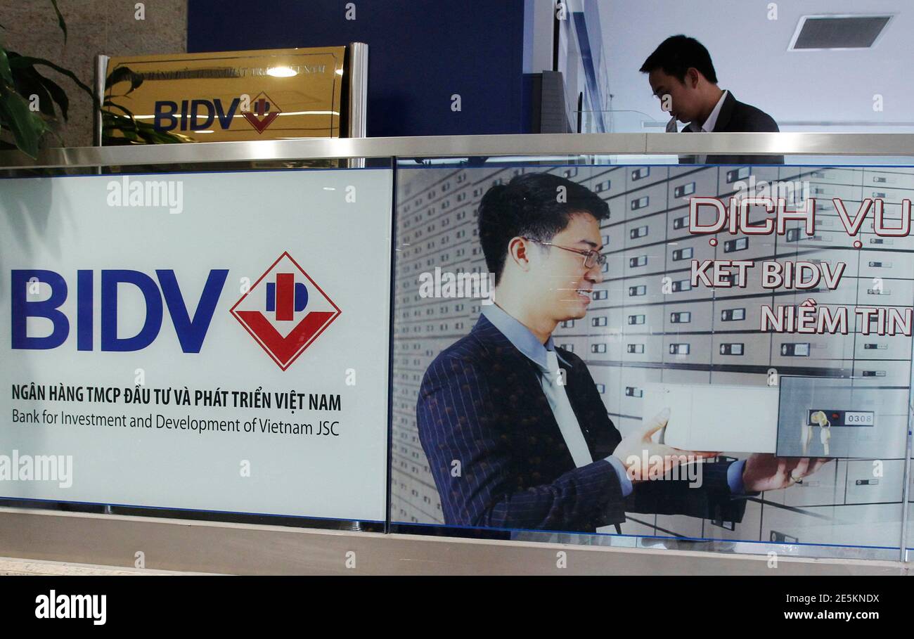 https www alamy com a man withdraws money from an atm machine at the headquarters of the bank for investment and development of vietnam bidv in hanoi january 20 2014 bidv will debut on the domestic stock exchange on jan 24 a senior executive said on monday as vietnams second largest bank by assets seeks to attract foreign investors through the 25 billion listing reuterskham vietnam tags business image399345686 html