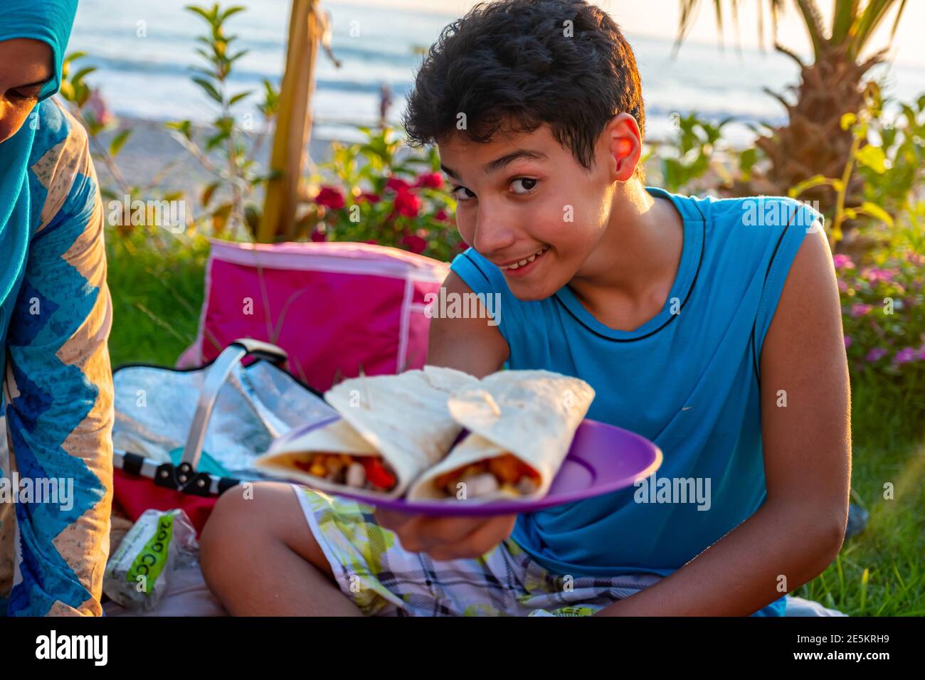 Yong boy is showing his sandwich Stock Photo picture image