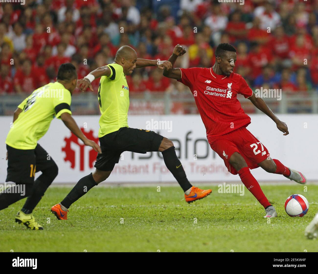 Liverpool S Dovock Origi R Kicks The Ball Next To Malaysia S Thiago Junior De Aquino C During Their Friendly Match In Kuala Lumpur Malaysia July 24 2015 Reuters Olivia Harris Stock Photo Alamy