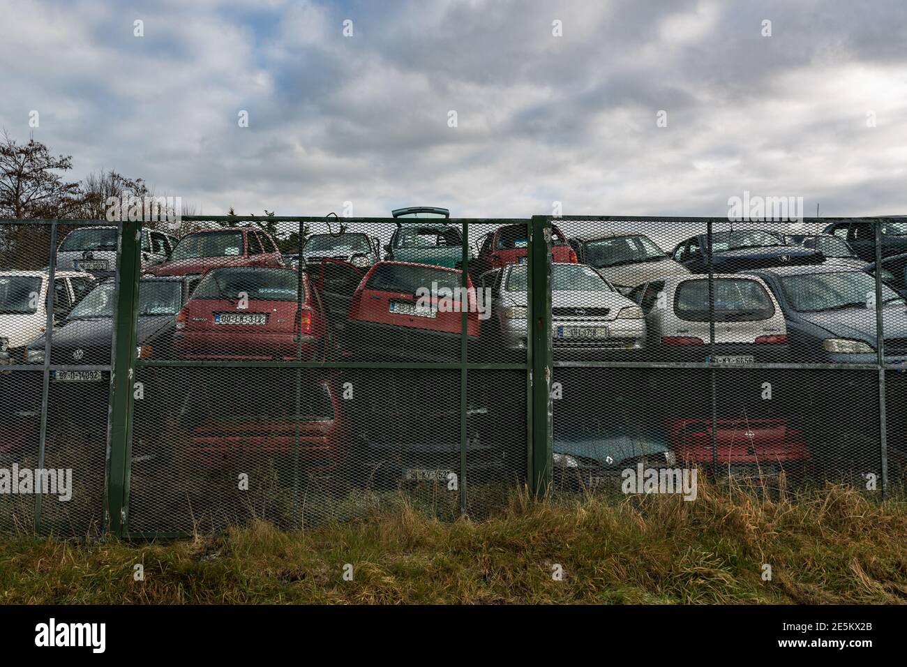 Listowel, Ireland - 7th January 2021: Pile of discarded old cars in a   junkyard. Stock Photo