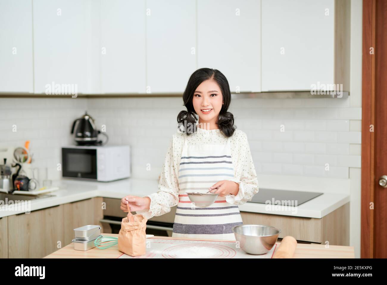 cooking and home concept - close up of female hands kneading dough at ...