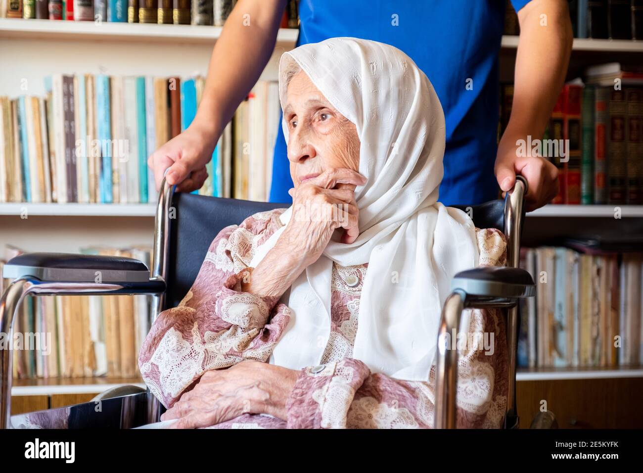 An old woman is wondering Stock Photo