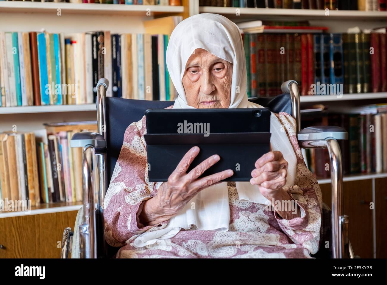 Grandma Using Tech Old woman is using technology Stock Photo - Alamy
