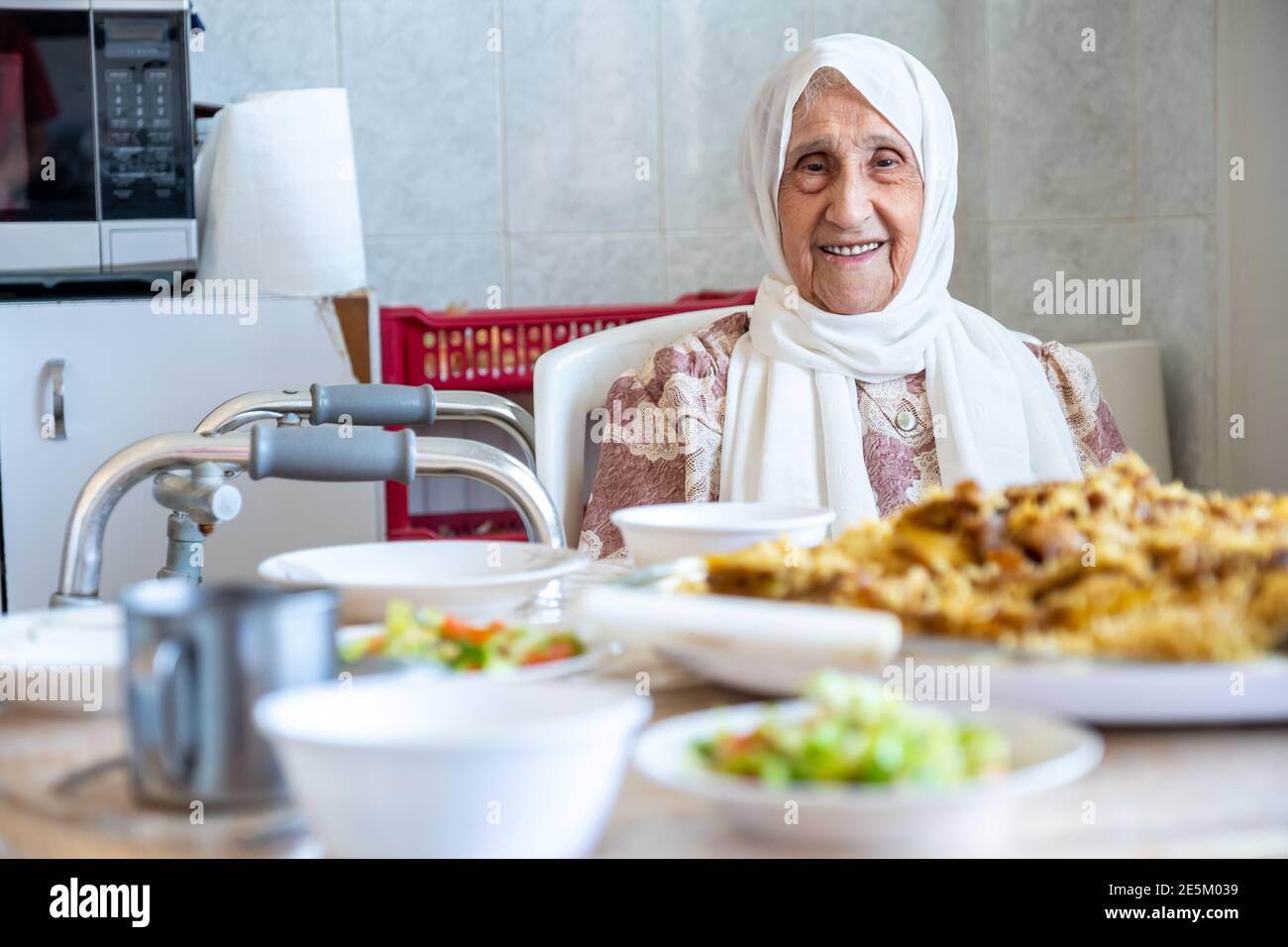 Old woman is using walker Stock Photo