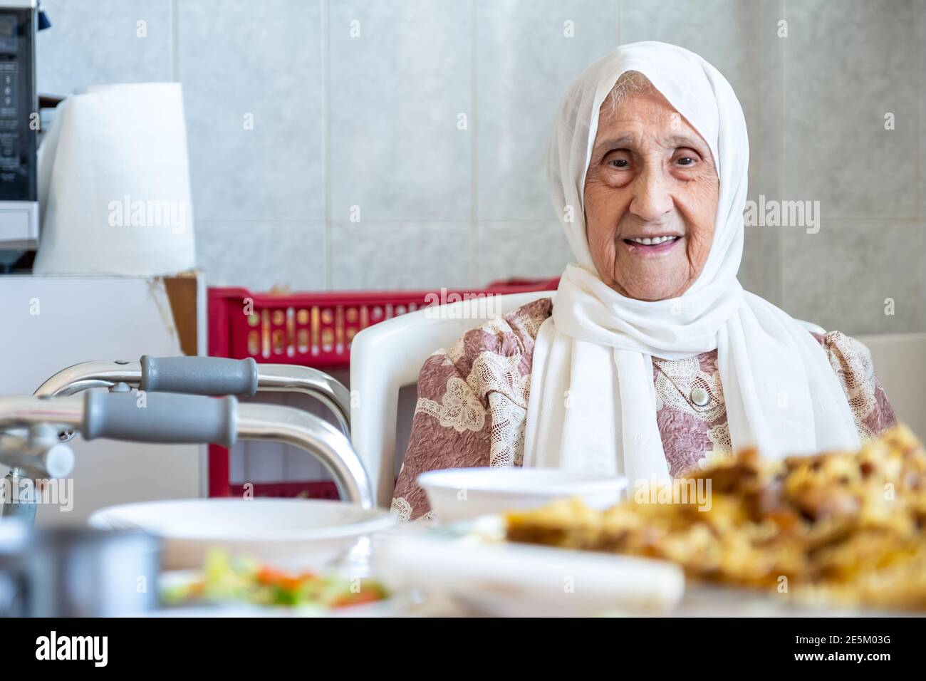 Old woman is using walker Stock Photo