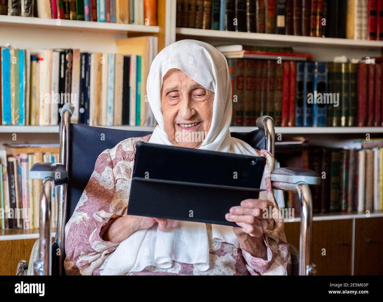 Old woman is using technology Stock Photo