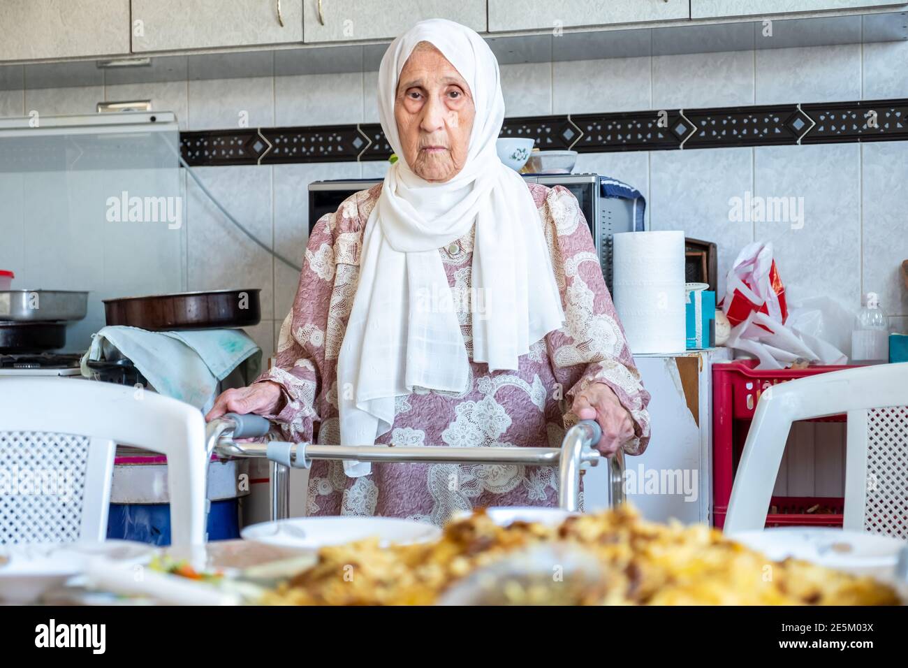 Old woman is using walker Stock Photo