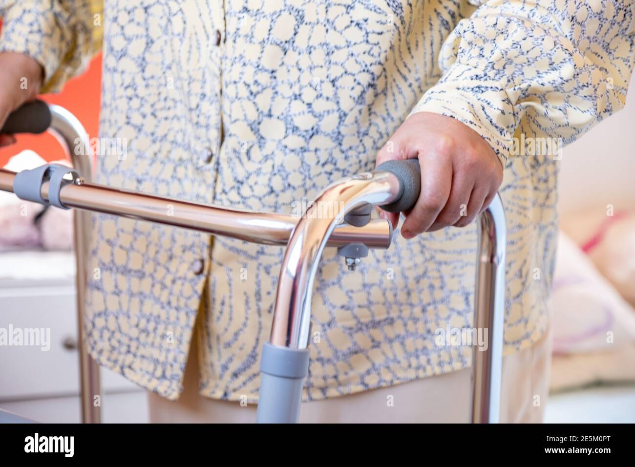 Muslim woman is using a walker Stock Photo