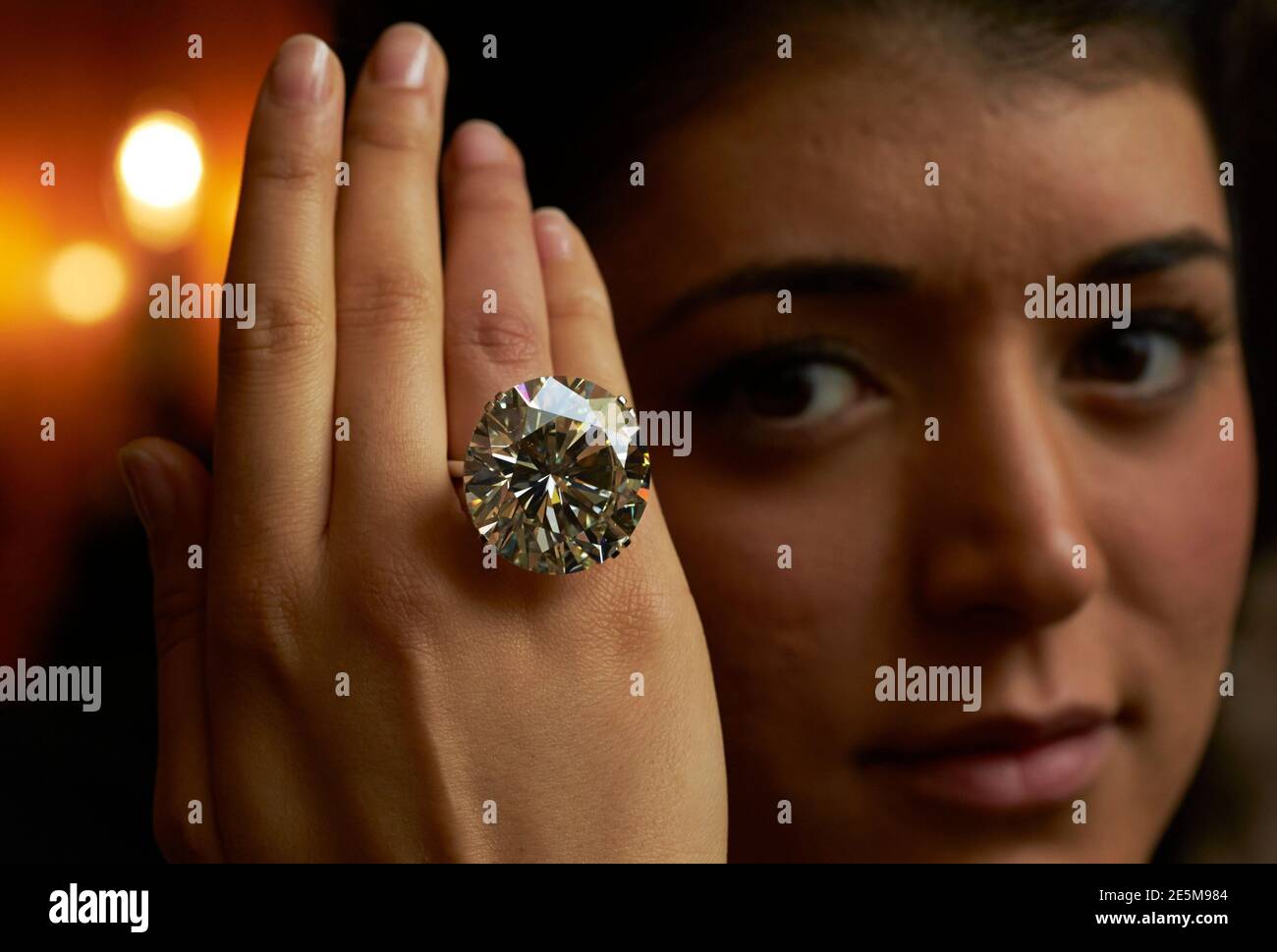 A model poses with a 103.46 carats diamond ring during an auction preview  at Sotheby's in Geneva May 7, 2014. The ring is expected to reach between  CHF 3,100,00 and 4,450,000 (USD