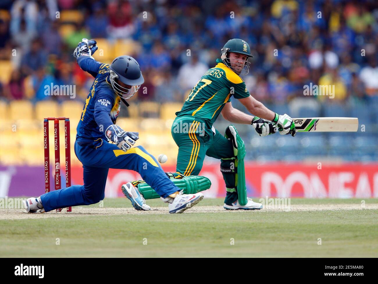 South Africa's captain AB de Villiers (R) plays a shot next to Sri Lanka's  Kumar Sangakkara during their first One Day International cricket match in  Colombo July 6, 2014. REUTERS/Dinuka Liyanawatte (SRI