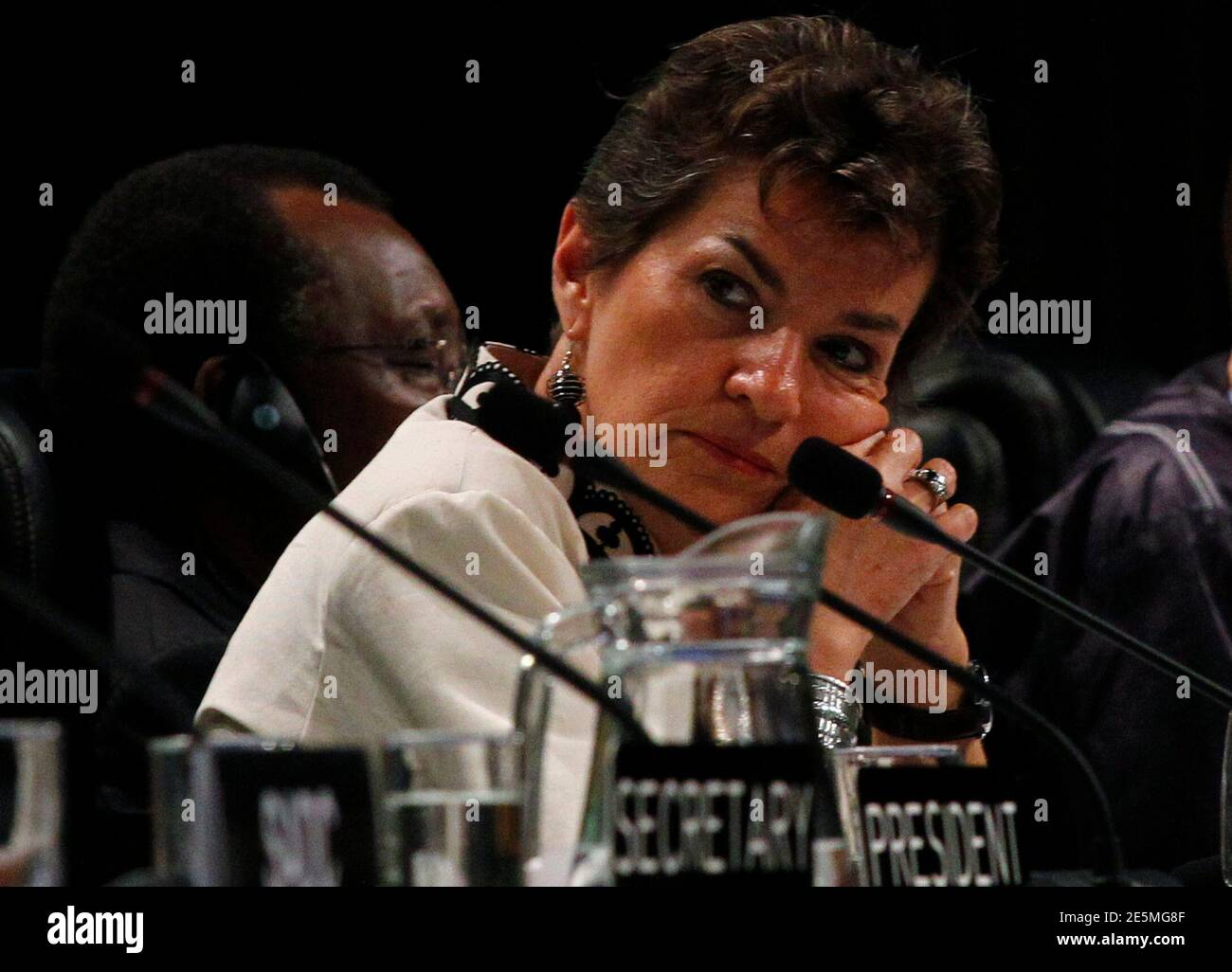 United Nations Framework Convention on Climate Change (UNFCCC) Executive Secretary Christiana Figueres listens to speakers at the opening plenary session of the Conference of the Parties (COP17) in Durban, November 28, 2011. Almost 200 nations began global climate talks on Monday with time running out to save the Kyoto Protocol aimed at cutting the greenhouse gas emissions scientists blame for rising sea levels, intense storms, drought and crop failures. The COP17 runs until December 9.  REUTERS/Mike Hutchings (SOUTH AFRICA - Tags: ENVIRONMENT POLITICS) Stock Photo