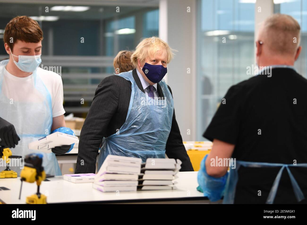 Prime Minister Boris Johnson (centre) is shown the Lighthouse ...