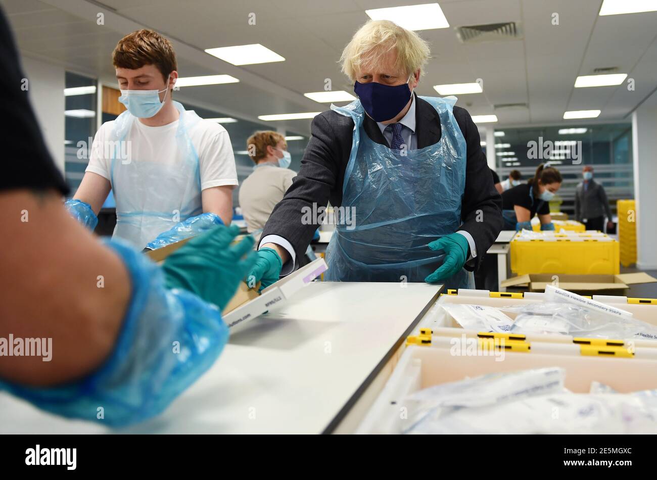 Prime Minister Boris Johnson is shown the Lighthouse Laboratory, used ...