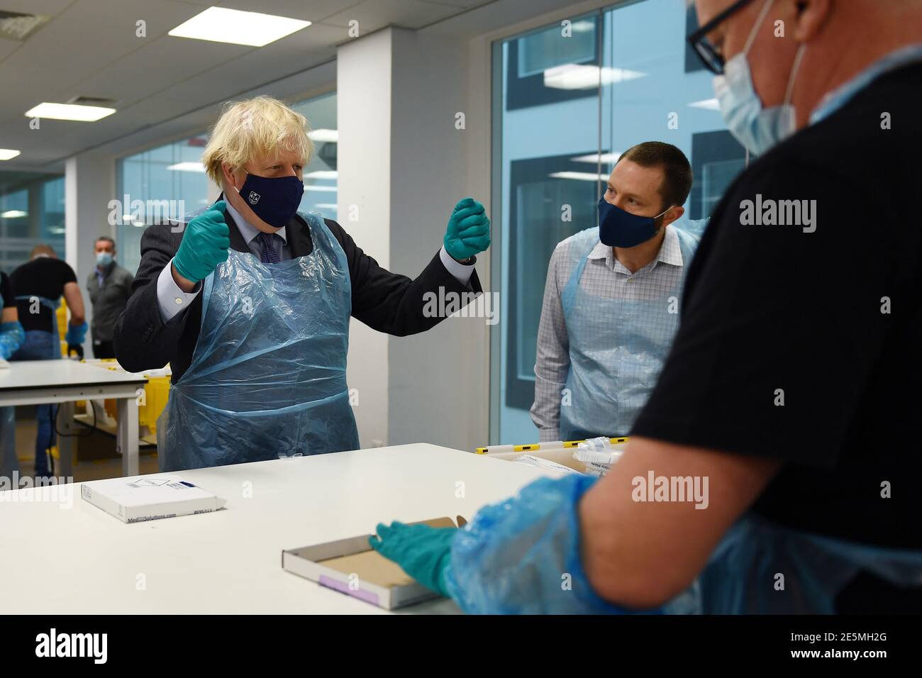Prime Minister Boris Johnson is shown the Lighthouse Laboratory, used ...