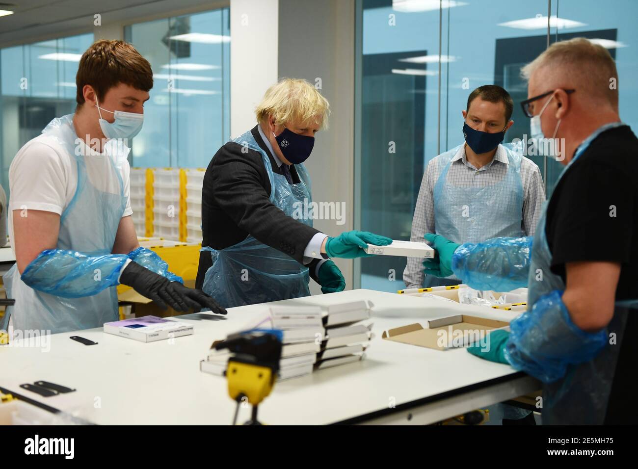 Prime Minister Boris Johnson is shown the Lighthouse Laboratory, used ...