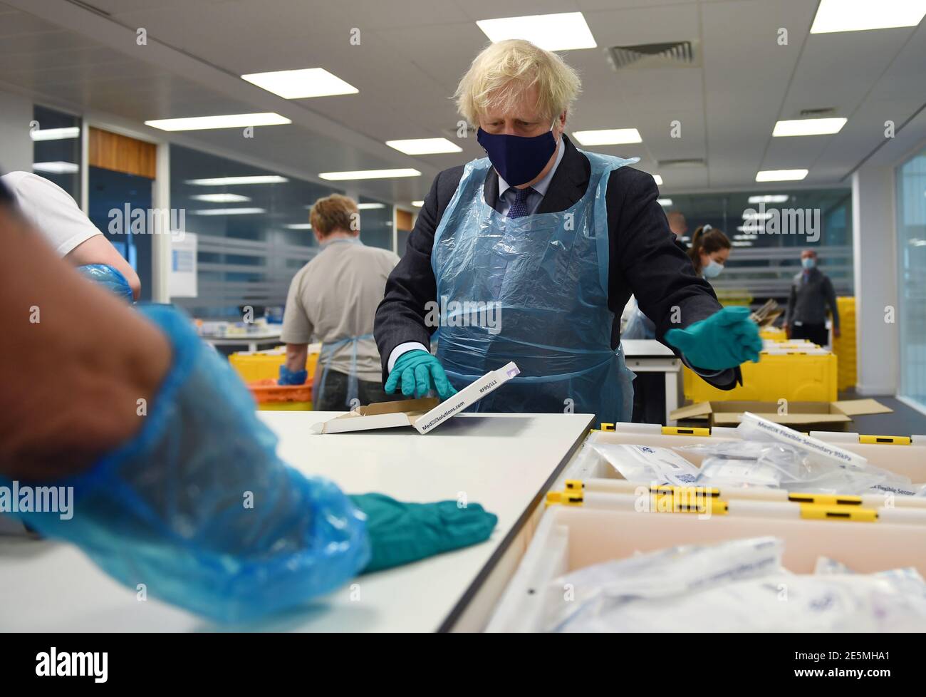 Prime Minister Boris Johnson is shown the Lighthouse Laboratory, used ...