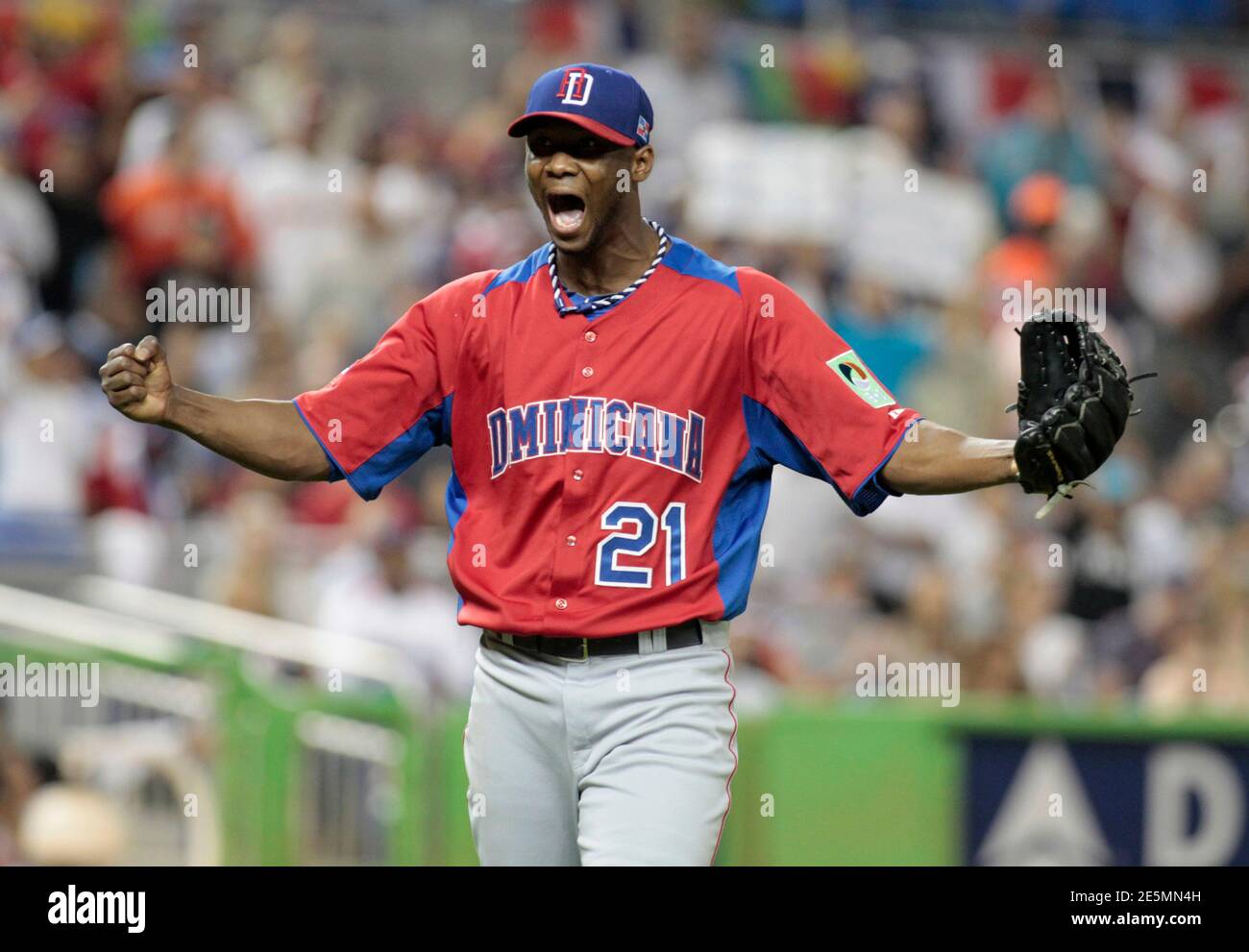 Dominican Republic starting pitcher Samuel Deduno reacts after a strikeout to end the fourth inning against the U.S. during a 2013 World Baseball Classic game in Miami, Florida March 14, 2013.  REUTERS/Joe Skipper  (UNITED STATES - Tags: SPORT BASEBALL) Stock Photo
