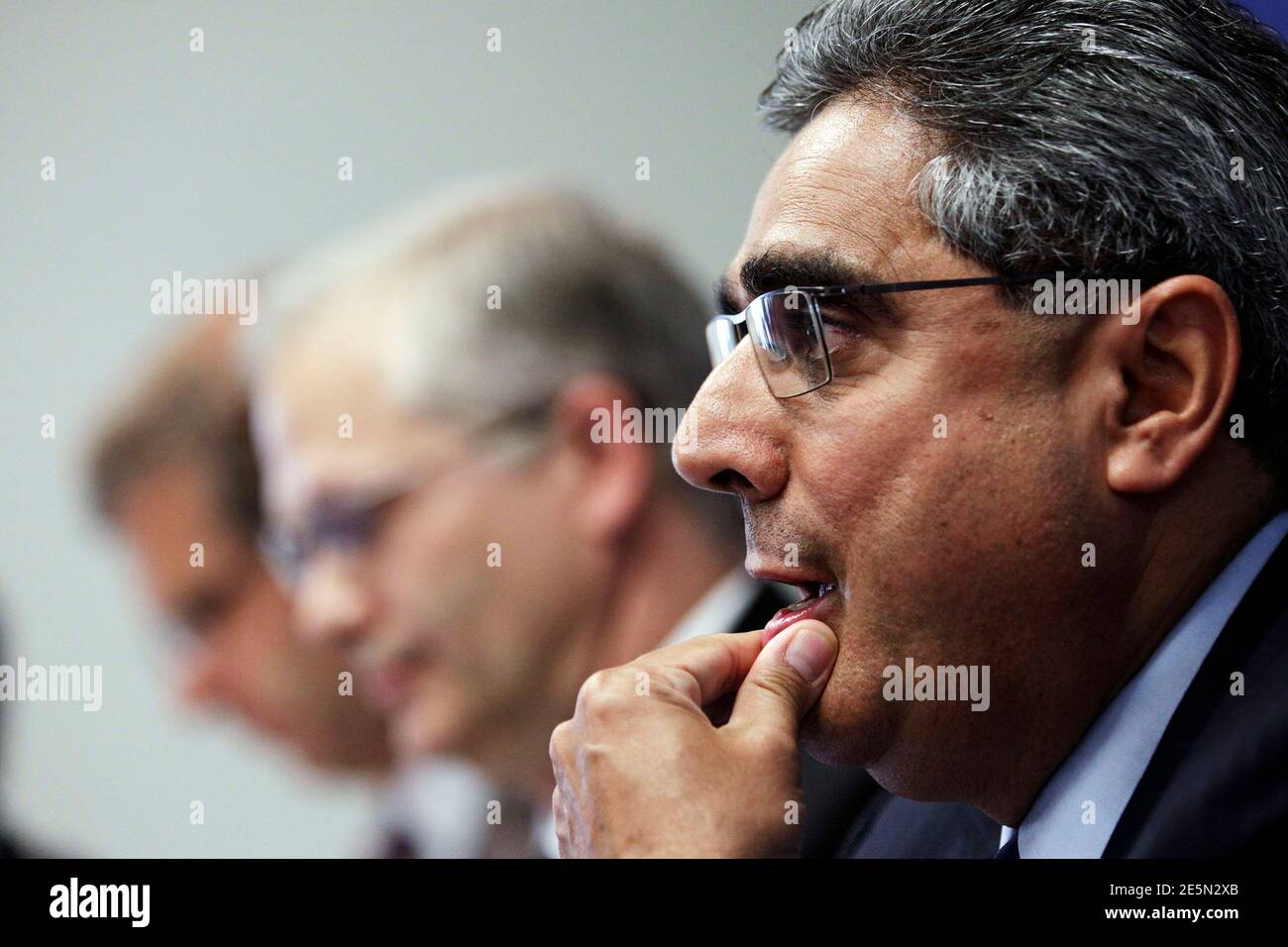 Deputy Director of the International Monetary Fund (IMF)'s European Department Ajai Chopra attends a joint news conference where the European Commission, ECB and IMF outlined Ireland's progress in meeting its targets as part of the EU/IMF bailout, in Dublin July 14, 2011. Rating agencies may be overestimating the risks associated with the current euro zone debt crisis and were it not for the contagion risk, Irish bond spreads would be narrower, a senior IMF official said on Thursday. REUTERS/Cathal McNaughton (IRELAND - Tags: POLITICS BUSINESS) Stock Photo