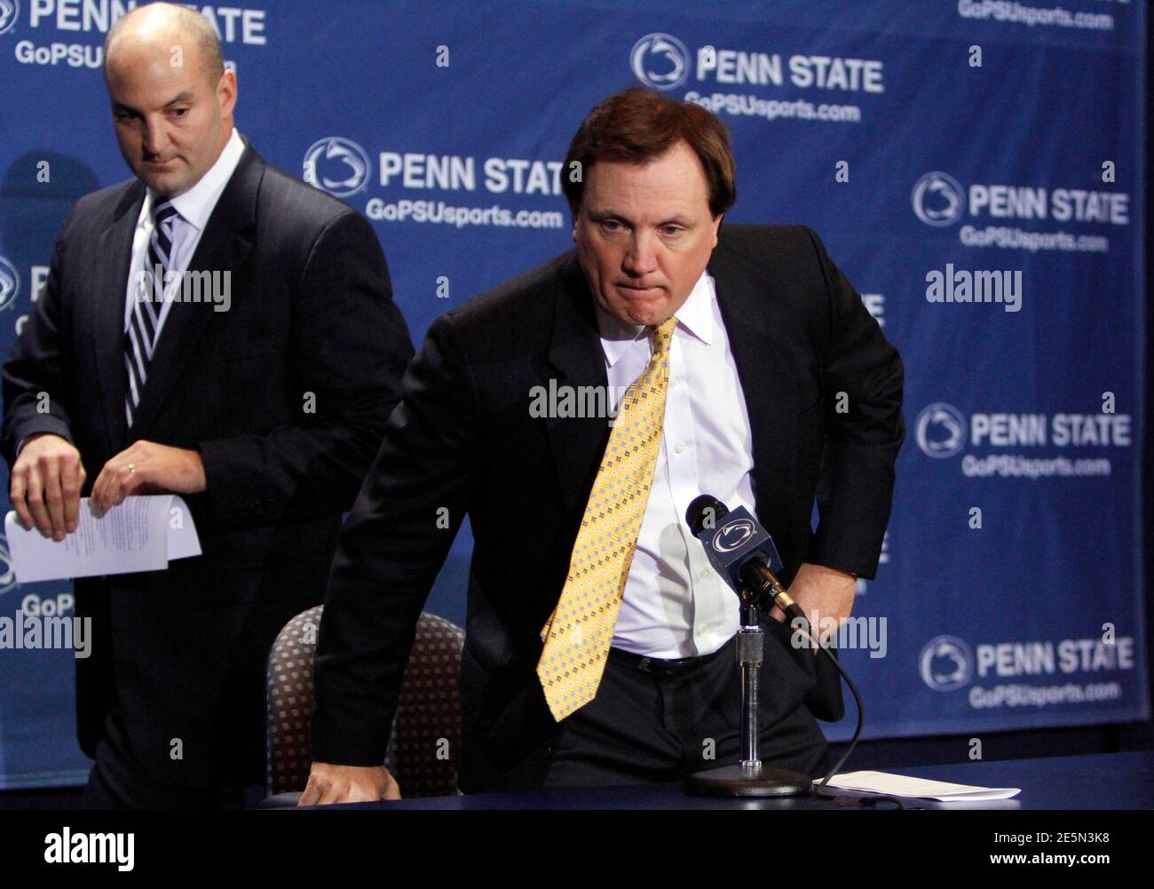 Acting Penn State Athletic Director Mark Sherburne (L) stands near interim football coach Tom Bradley during a news conference at Beaver stadium in State College, Pennsylvania November 10, 2011. Bradley will replace coach Joe Paterno who was fired amid a scandal over allegations about long-time assistant coach, Jerry Sandusky, who was charged with sexually abusing at least eight young boys over a decade. REUTERS/Tim Shaffer (UNITED STATES - Tags: SPORT FOOTBALL EDUCATION CRIME LAW) Stock Photo