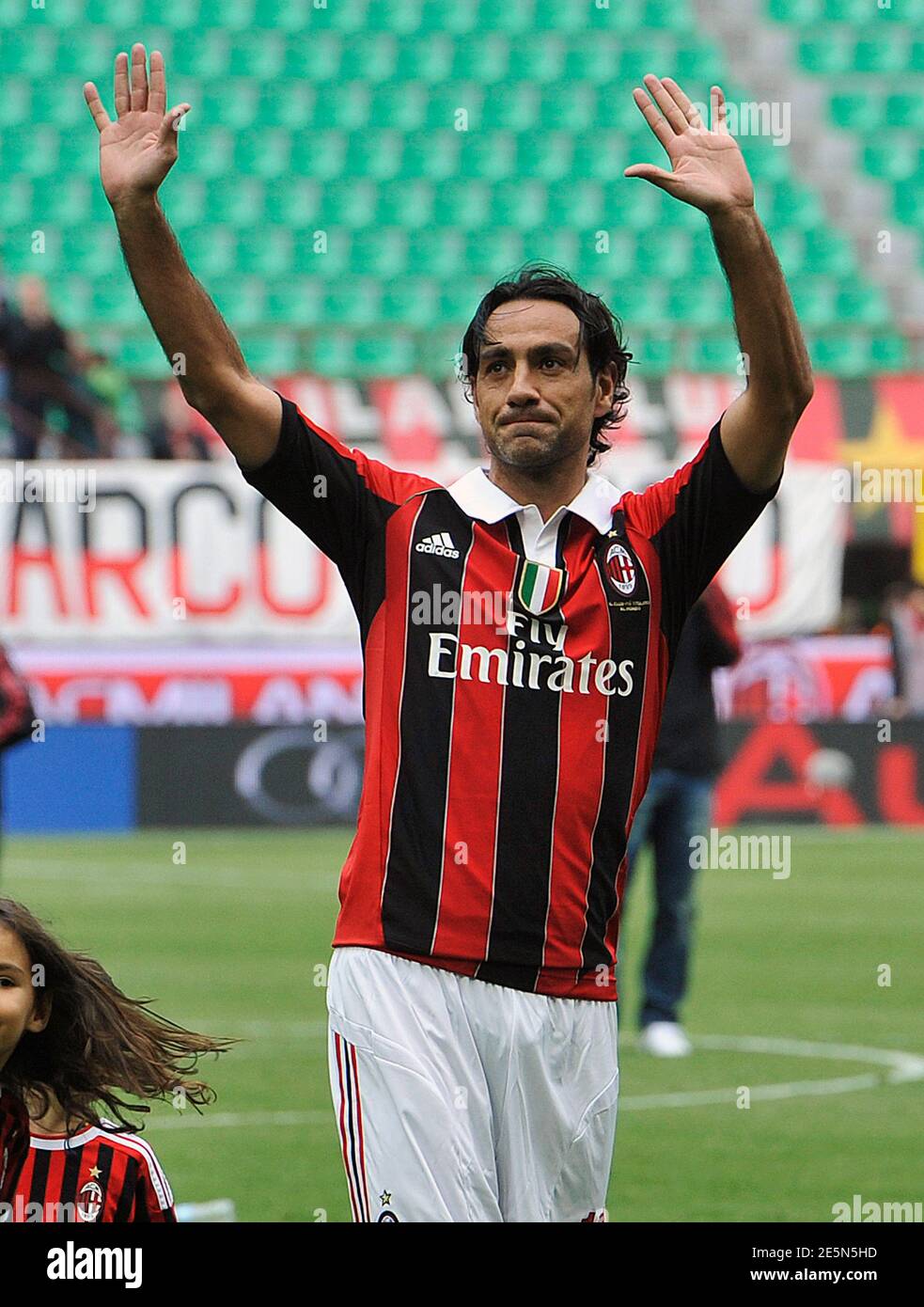 AC Milan's Alessandro Nesta greets supporters at the end of the Serie A  soccer match against Novara at the San Siro stadium in Milan May 13, 2012.  REUTERS/Paolo Bona (ITALY - Tags: