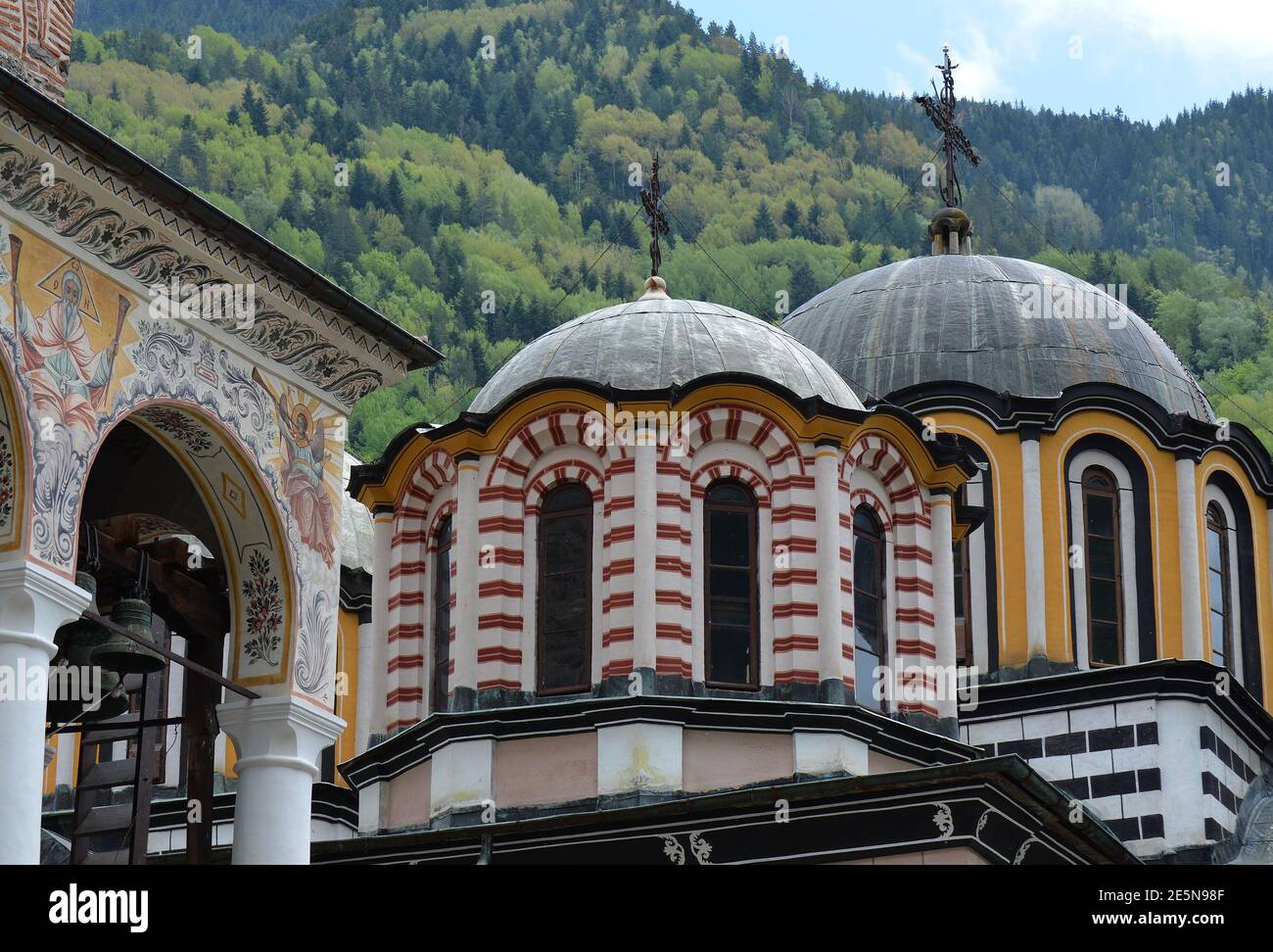 Rila Church Domes at Rila Monastery, Bulgaria with forest in the background Stock Photo