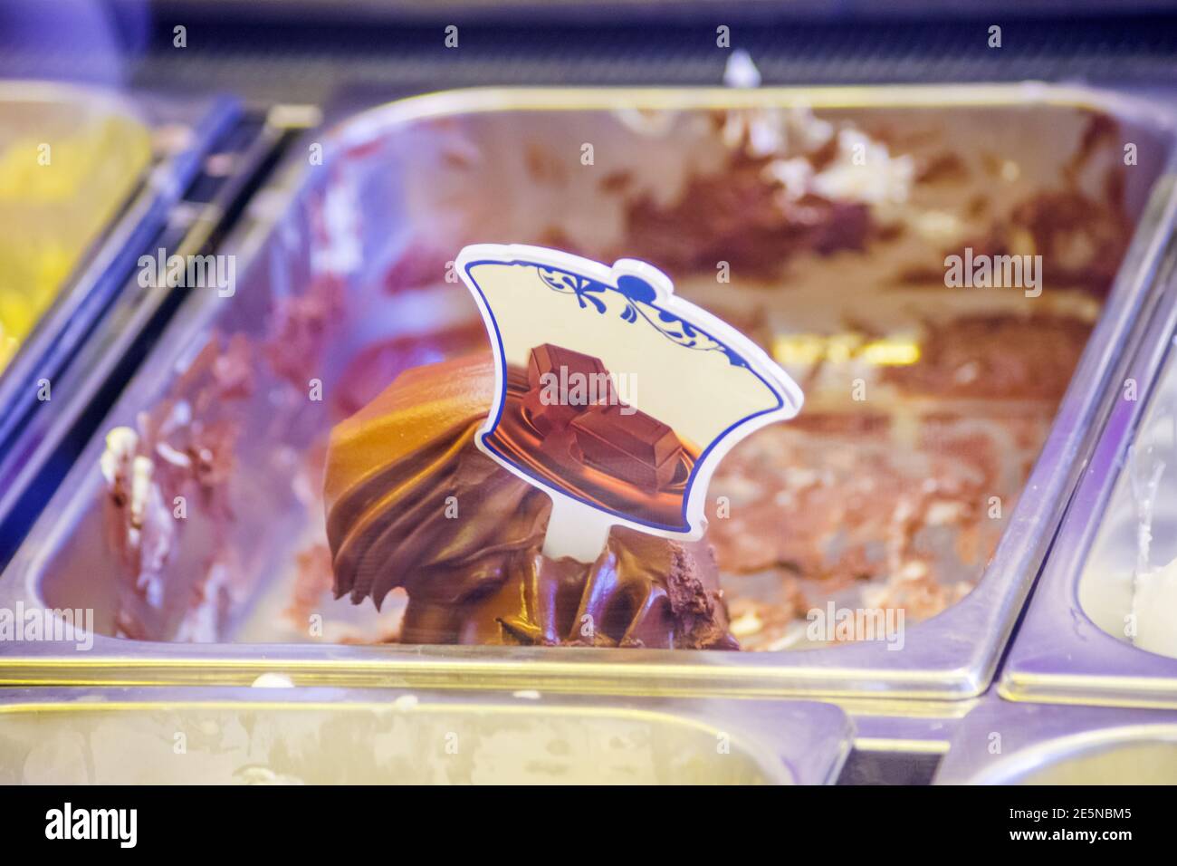 ice cream shop with many delicious flavors on display, chocolate