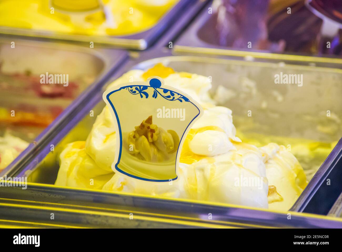 ice cream shop with many delicious flavors on display, chocolate