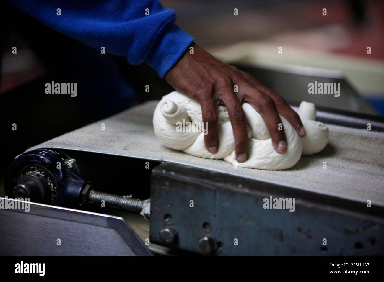 An Employee Lifts A Bread Roll Before It Is Baked At The Dganit Ein Bar Bakery Near Tel Aviv February 10 2011 Israeli Prime Minister Benjamin Netanyahu Has Come Under Heavy Political