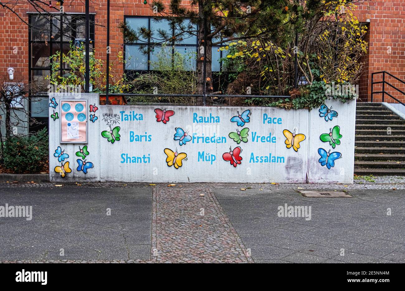 Omas Garten, Community educational & day care centre for children & parents, Swinemünder Straße 26,Berlin Germany. wall with peace in many languages Stock Photo