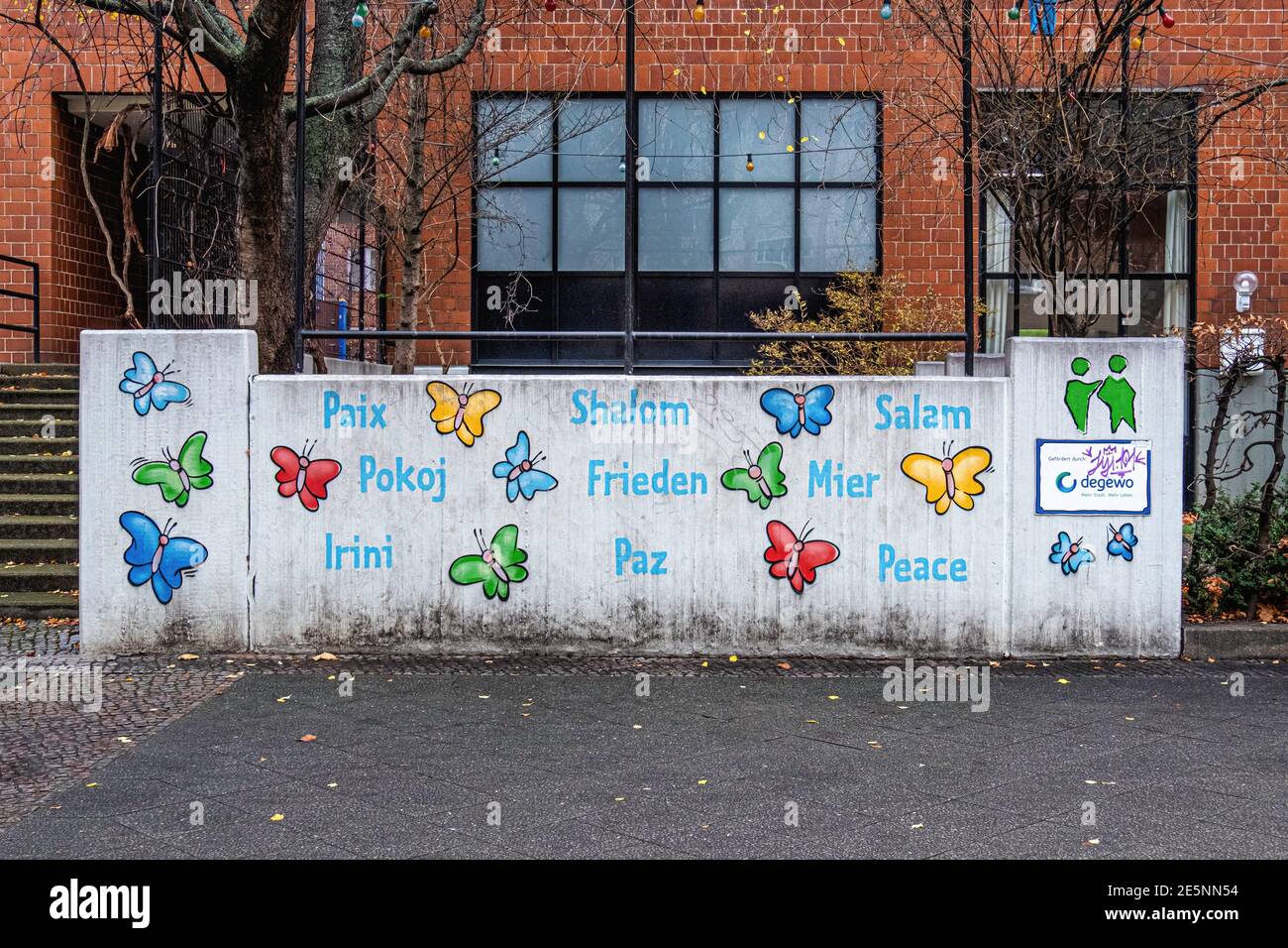 Omas Garten, Community educational & day care centre for children & parents, Swinemünder Straße 26,Berlin Germany. wall with peace in many languages Stock Photo