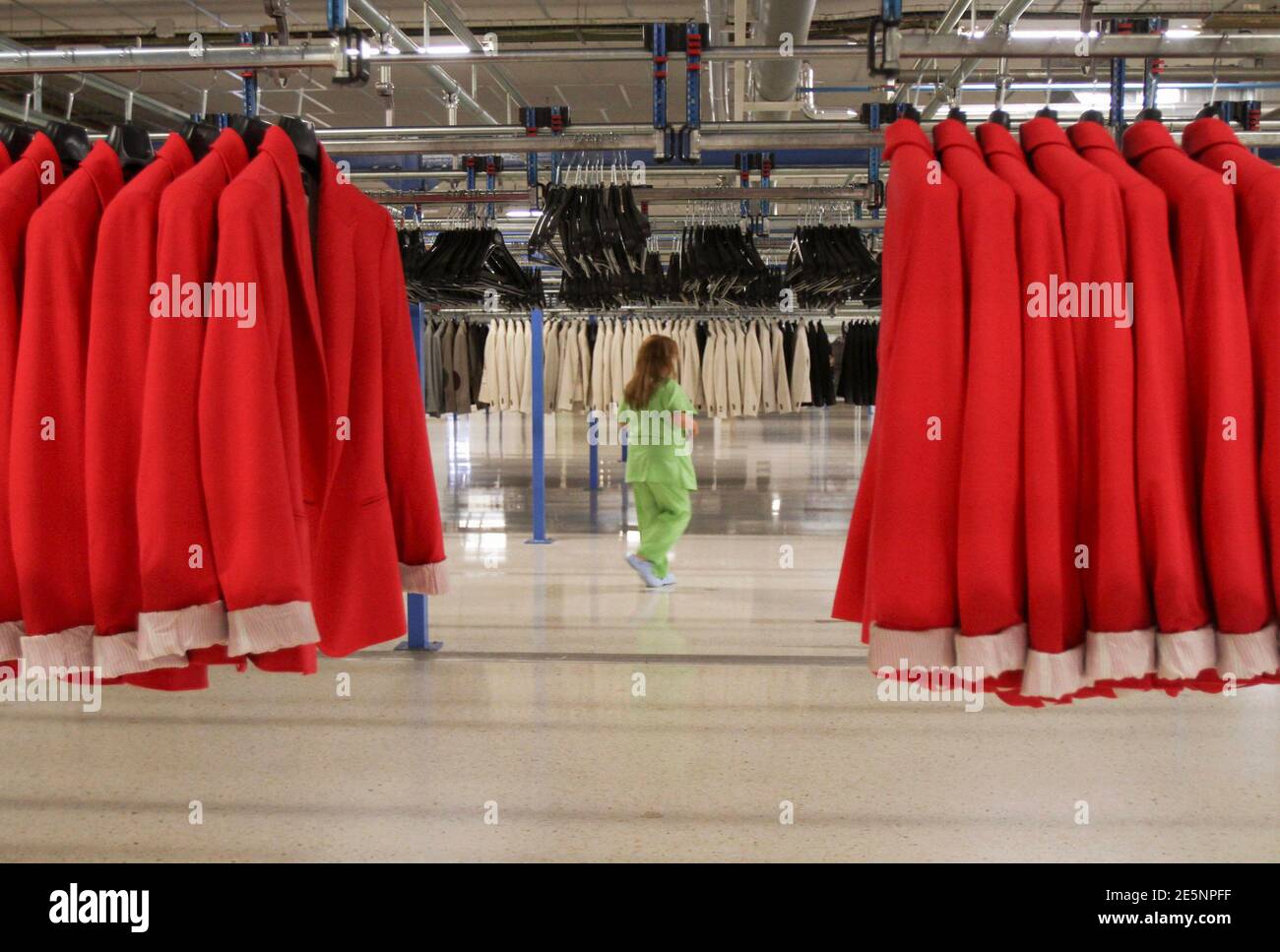 A woman works at the Zara factory at the headquarters of Inditex group in  Arteixo, northern Spain, June 14, 2012. Spain's Inditex SA, the world's  largest clothes retailer, bucked Europe's financial crisis