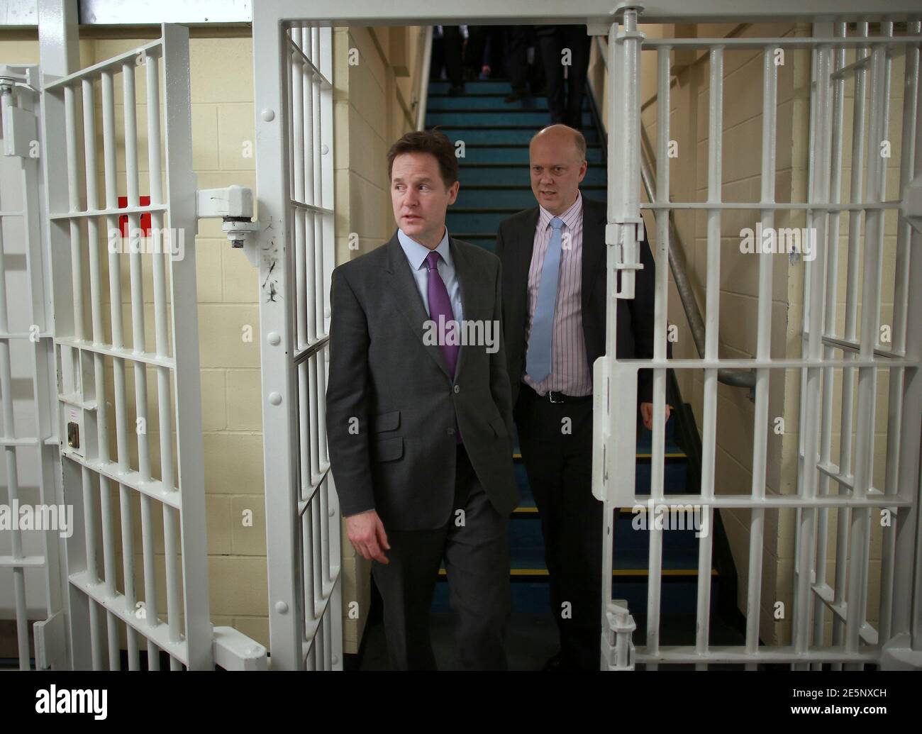 Britain's Deputy Prime Minister Nick Clegg (L) and Justice Minister Chris Grayling pay a visit to the Cookham Wood Young Offenders Institution in Rochester, southern England January 16, 2014.  REUTERS/Peter Macdiarmid/Pool   (BRITAIN - Tags: CRIME LAW POLITICS) Stock Photo