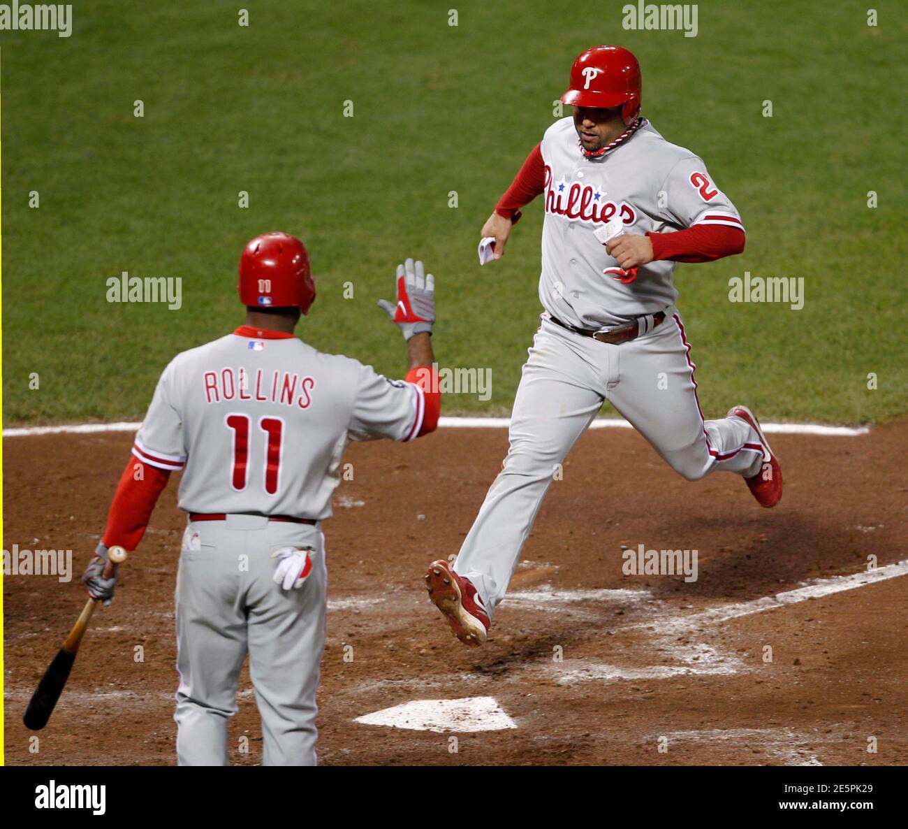 Philadelphia Phillies Placido Polanco R Scores On A Wild Pitch As Hitter Jimmy Rollins Celebrates In The Fifth Inning Against The San Francisco Giants During Game 4 Of Their Major League Baseball Philadelphia Phillies Placido Polanco R Scores On A Wild Pitch As Hitter Jimmy Rollins Celebrates In The Fifth Inning Against The San Francisco Giants During Game 4 Of Their Major League Baseball
