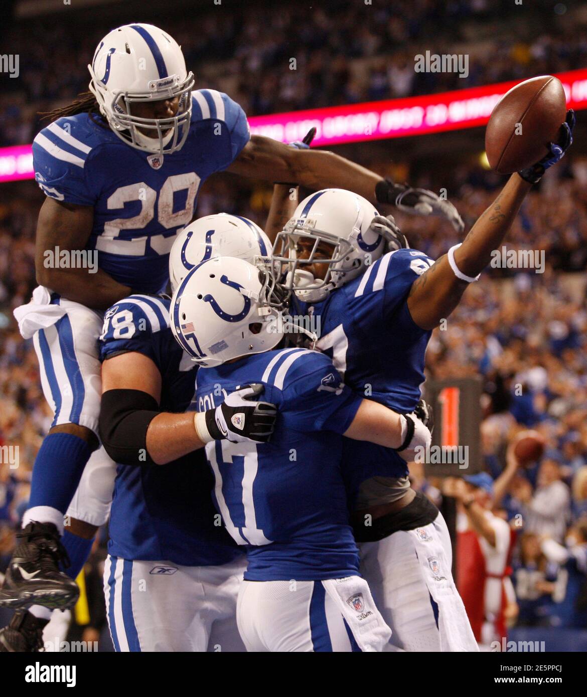 Indianapolis Colts running back Joseph Addai (29), Colts offensive guard Mike Pollak, Colts wide receiver Austin Collie (17) and Colts wide receiver Reggie Wayne (R) celebrate Wayne's touchdown catch during the fourth quarter of their NFL football game against the Houston Texans in Indianapolis December 22, 2011. REUTERS/Brent Smith (UNITED STATES - Tags: SPORT FOOTBALL TPX IMAGES OF THE DAY) Stock Photo