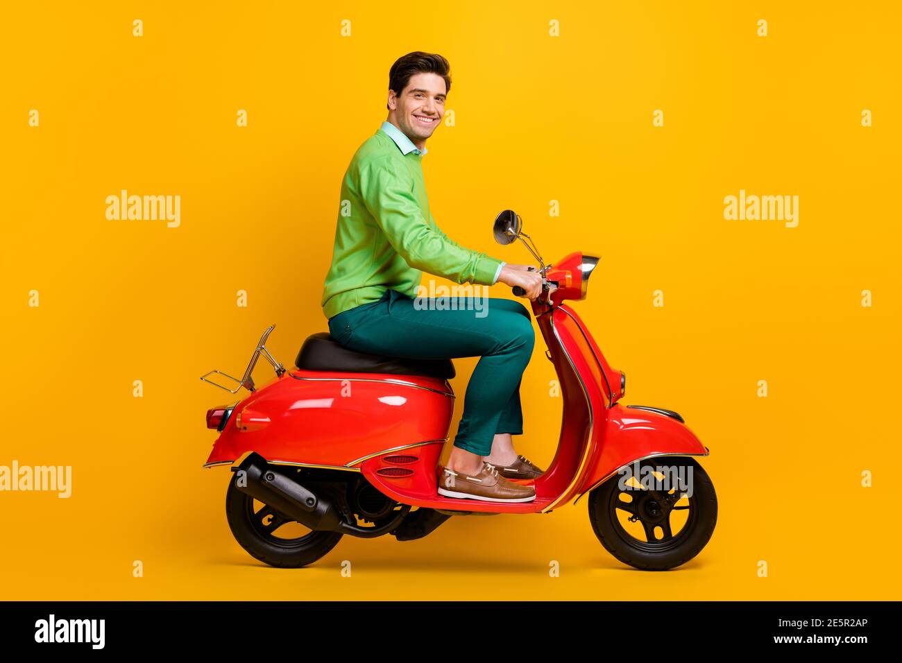 Full body profile portrait of young moped driver toothy smile wear ...