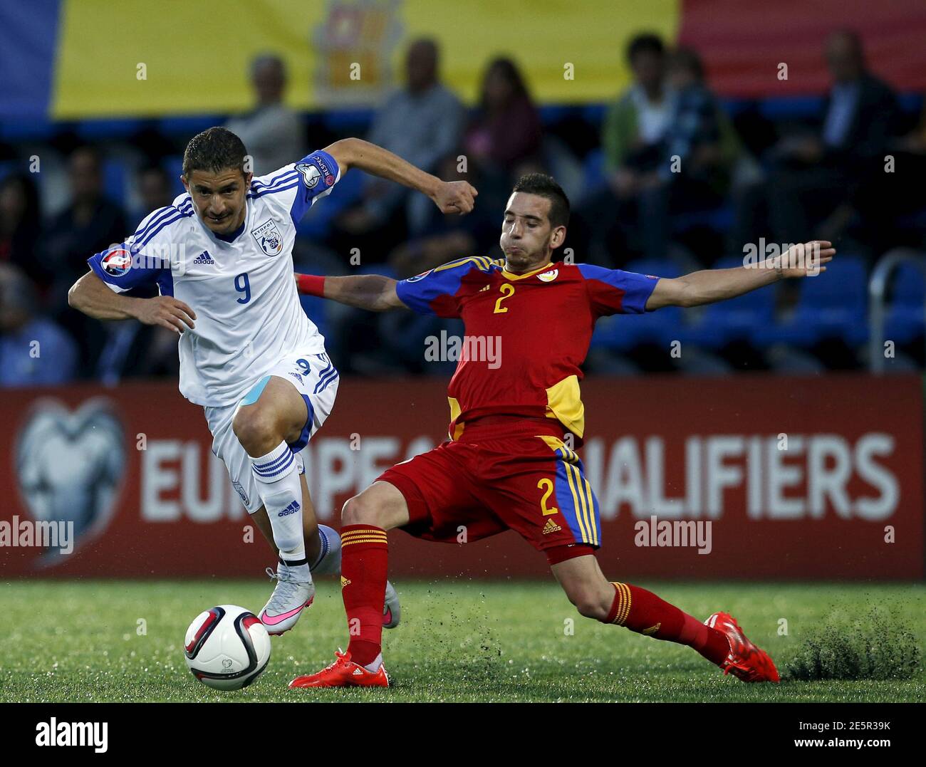 Cyprus S Dimitris Christofi L Fights For The Ball With Andorra S Cristian Martinez During Their Euro 16 Group B Qualifying Soccer Match At Estadi Nacional Stadium In Andorra La Vella Andorra June 12