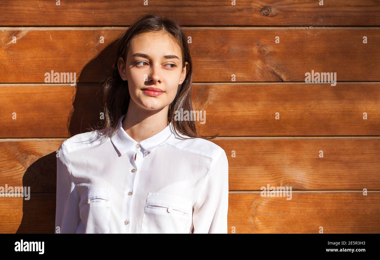 Close up portrait of a young beautiful girl in white shirt Stock Photo ...