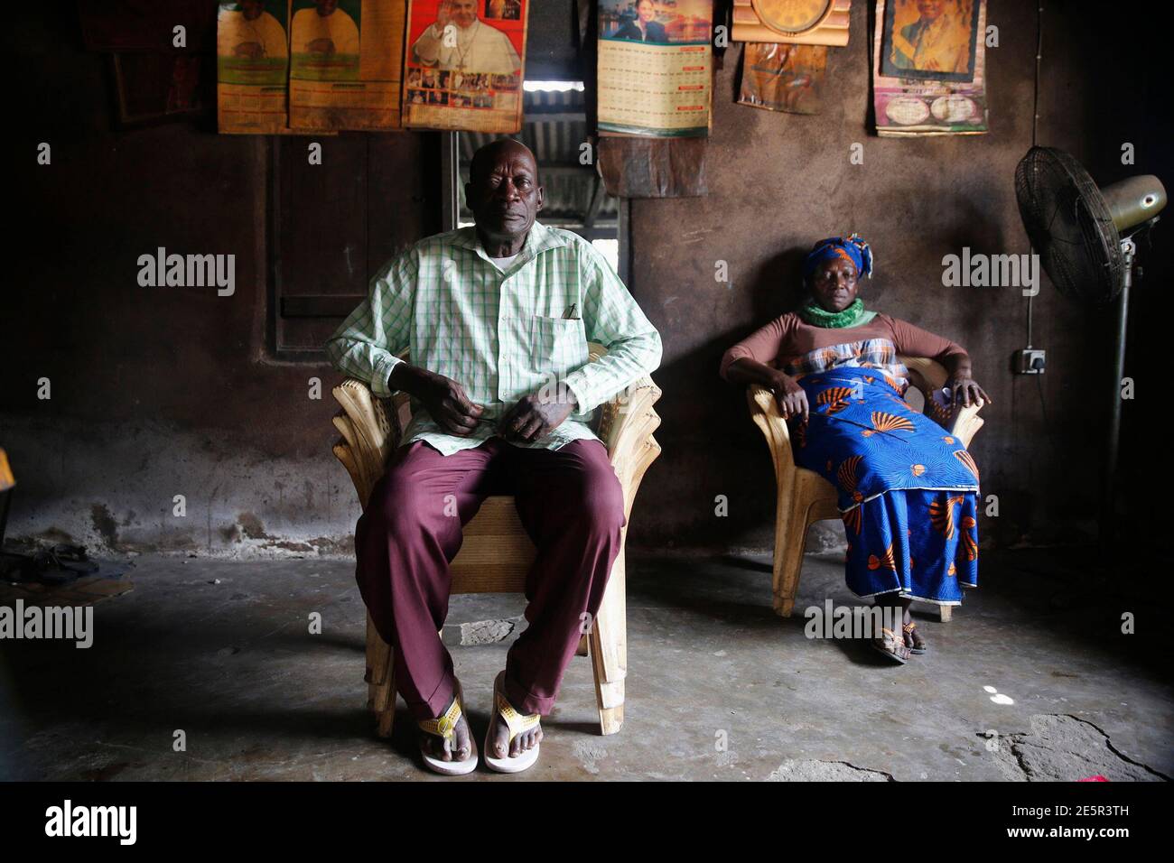 Environmental activist Fedelis Oguru, who filed a suit with the support of Friends of Earth international in a court against Shell oil company in Netherlands, sits for portrait photograph in his home in Oruma village, Ogbia district in Nigeria's Bayelsa state, March 1, 2015. Nigerian President Goodluck Jonathan's flagship reform policies -- power and farming -- have not hugely benefited the delta. Power privatisation has yet to translate to more kilowatts on the grid anywhere, while reforms to farming, especially cutting corrupt middle men out of a state fertiliser scheme, has disproportionate Stock Photo