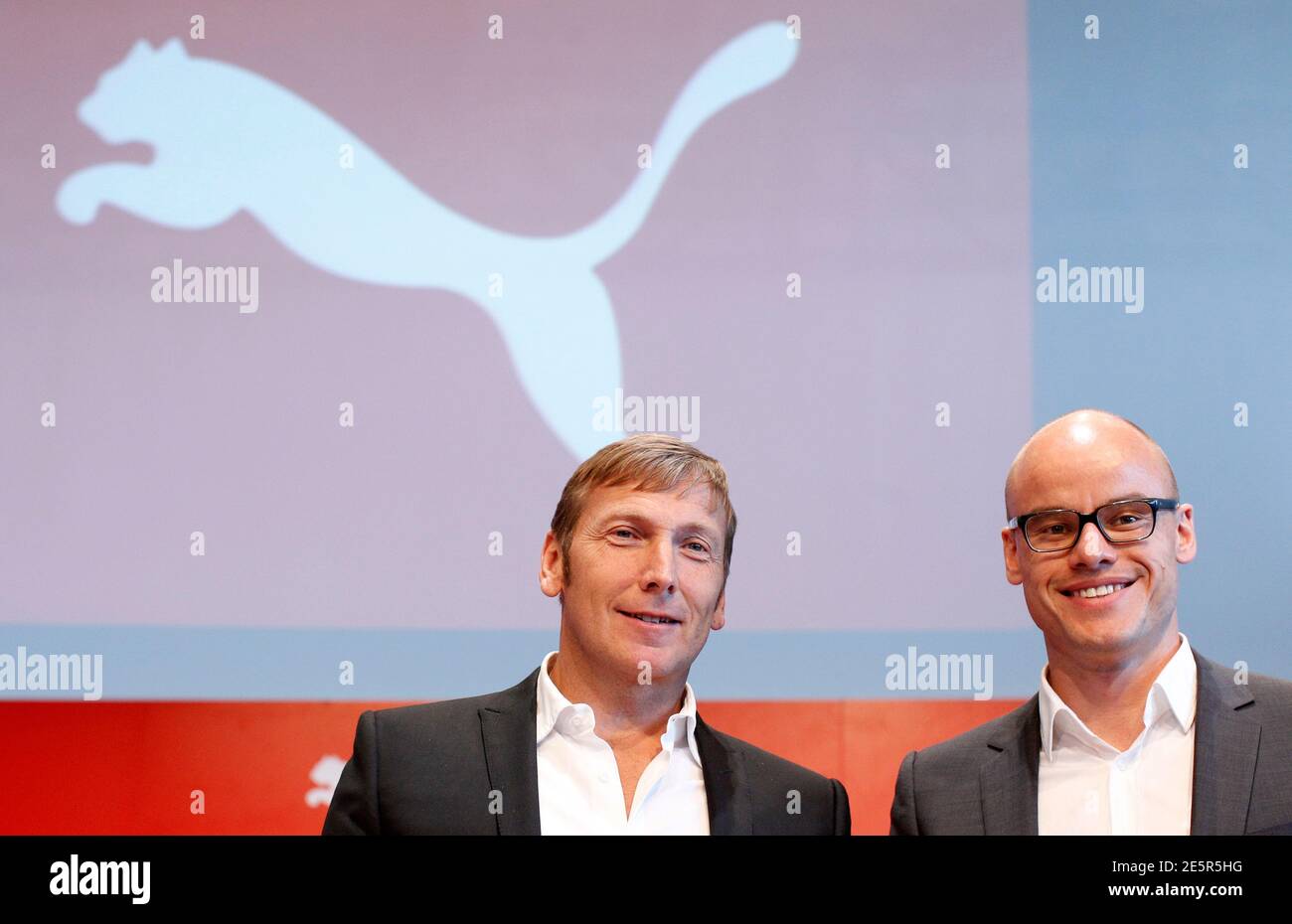 Jochen Zeitz (L) CEO of German sports goods firm Puma and Franz Koch, head  of strategy and development, arrive for company's annual shareholders'  meeting in Herzogenaurach April 14, 2011. Puma announced on