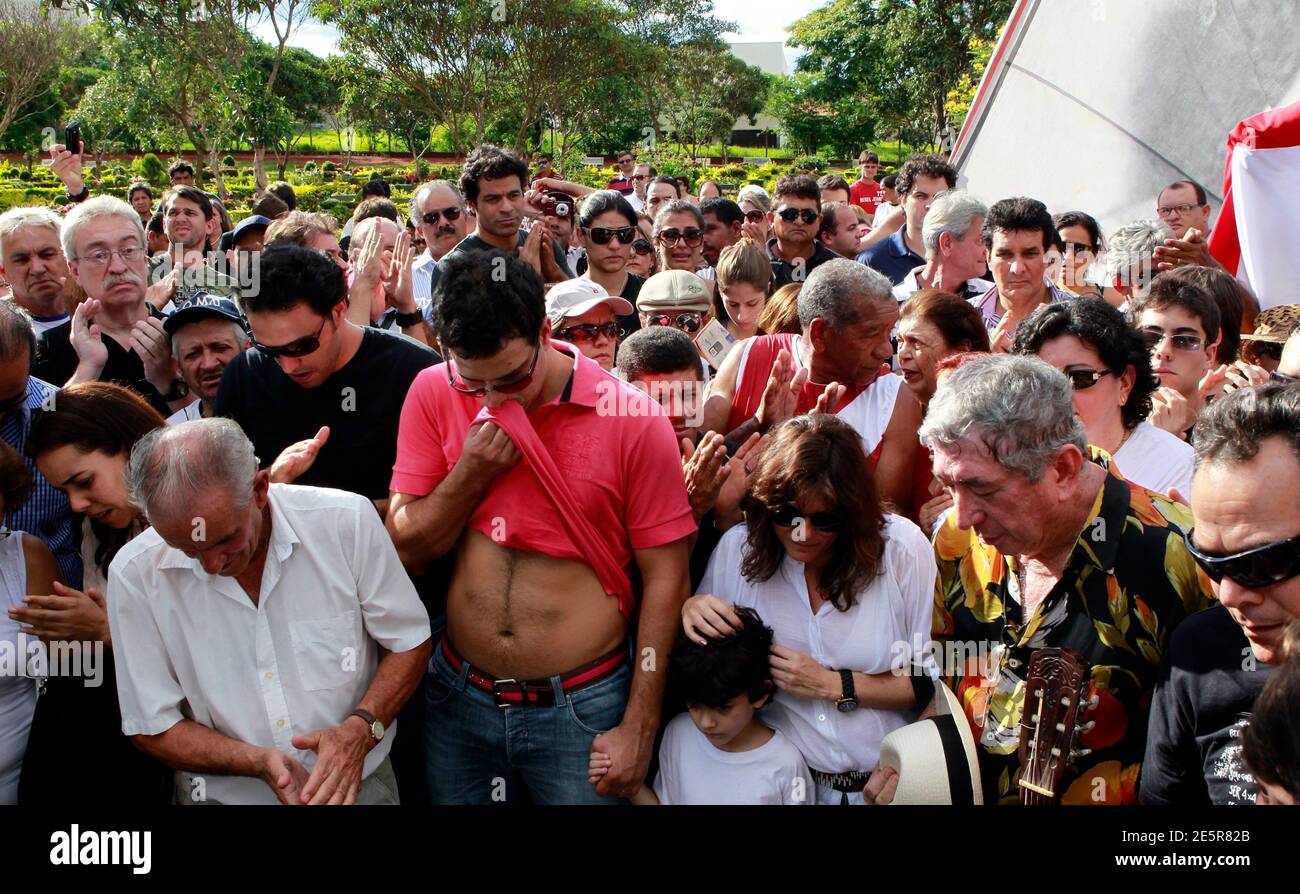 Relatives of Brazil's 1982 World Cup captain Socrates attend his funeral ceremony in Ribeirao Preto December 4, 2011. Socrates, the 'Golden Heel' renowned as one of the great playmakers of his generation, died in hospital on Sunday of septic shock at the age of 57, his doctors said in a statement. REUTERS/Paulo Whitaker (BRAZIL - Tags: SPORT SOCCER OBITUARY) Stock Photo